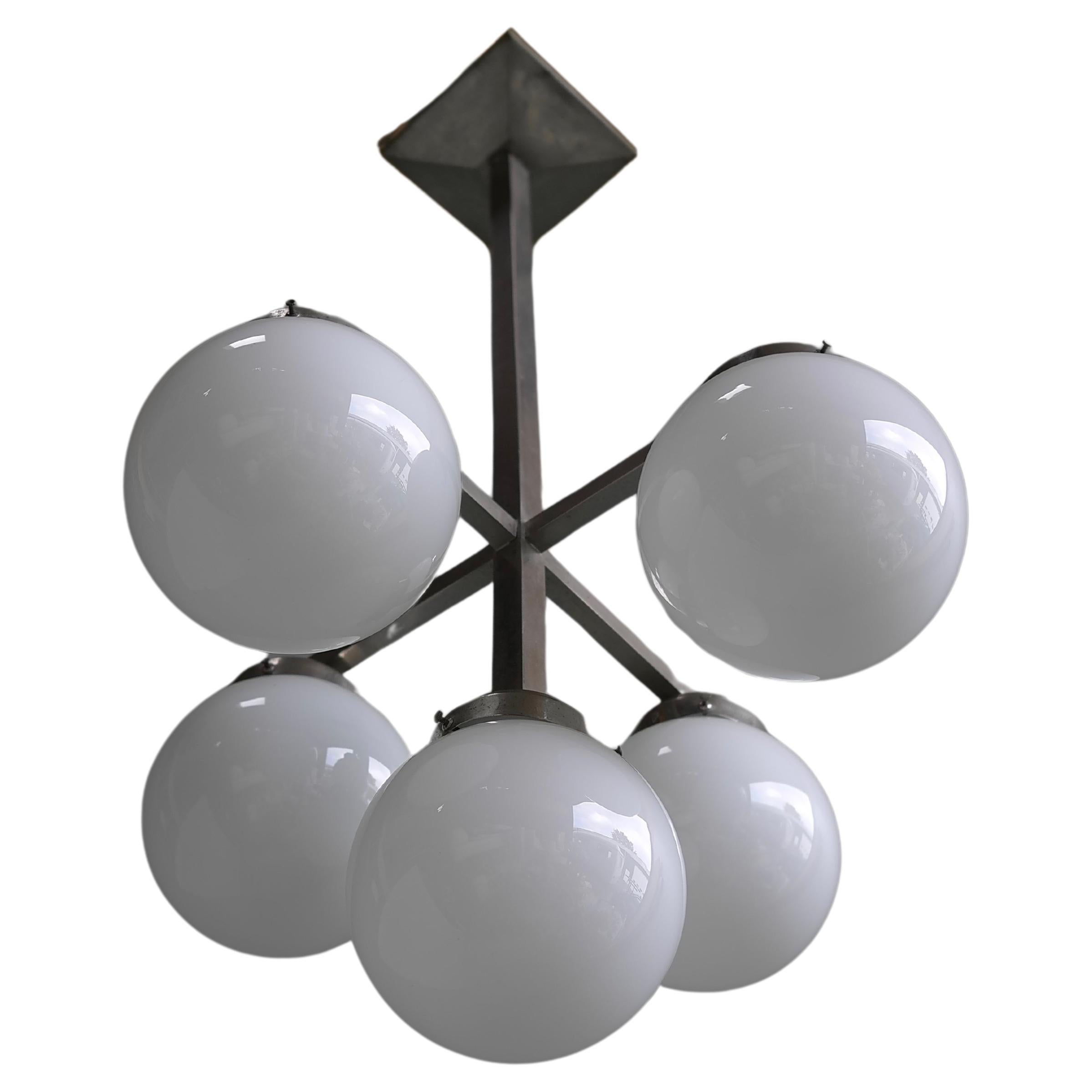 Monumental Art Deco Pendant in Metal with White Glass Balls, circa 1935

Would fit perfect in any hallway or other space.


