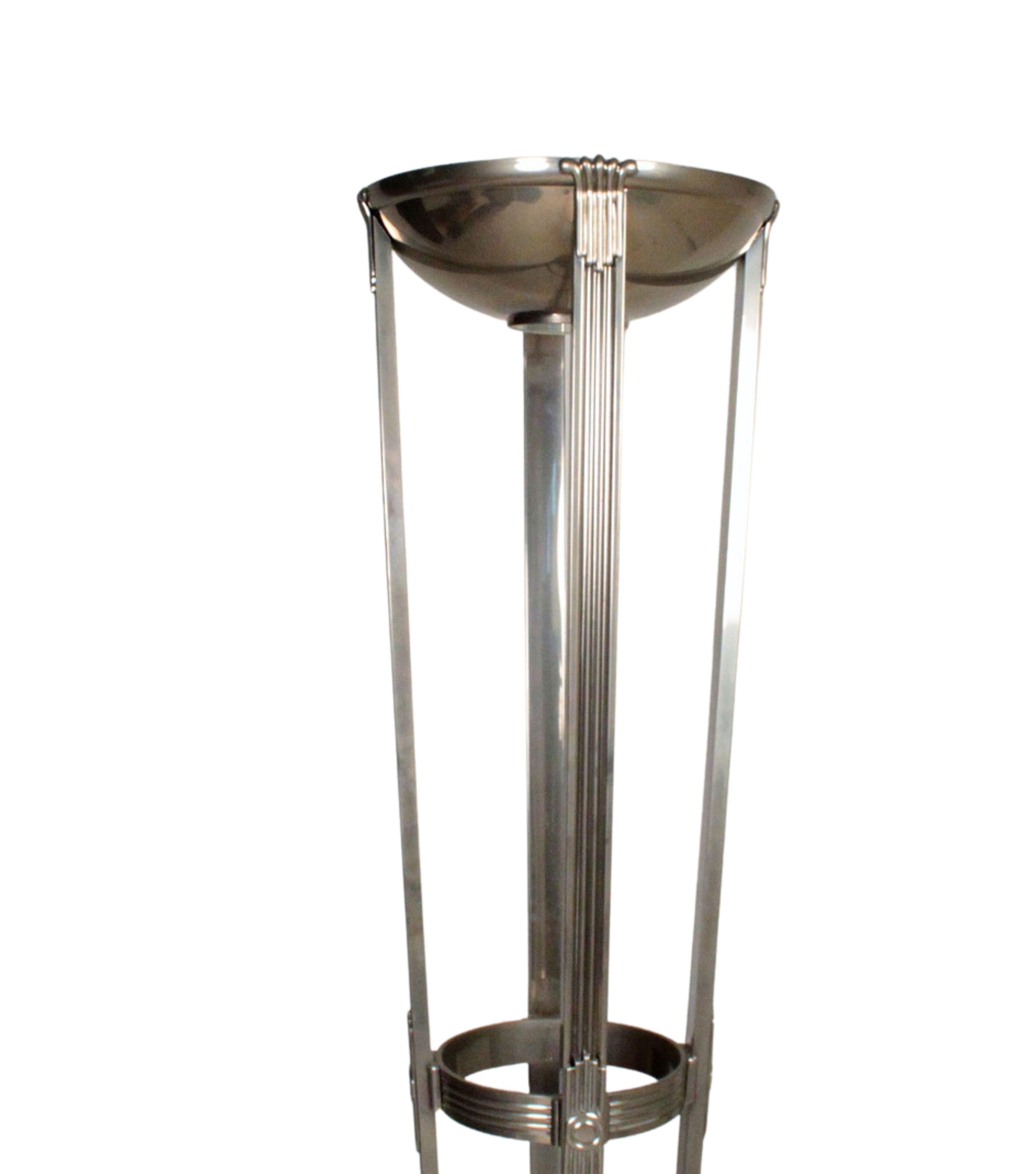 This art deco style floor lamp from the 1970s is a unique and impressive work of art made from chrome-plated metal and frosted glass. Its striking design and quality materials make it a timeless addition to any modern or contemporary interior.