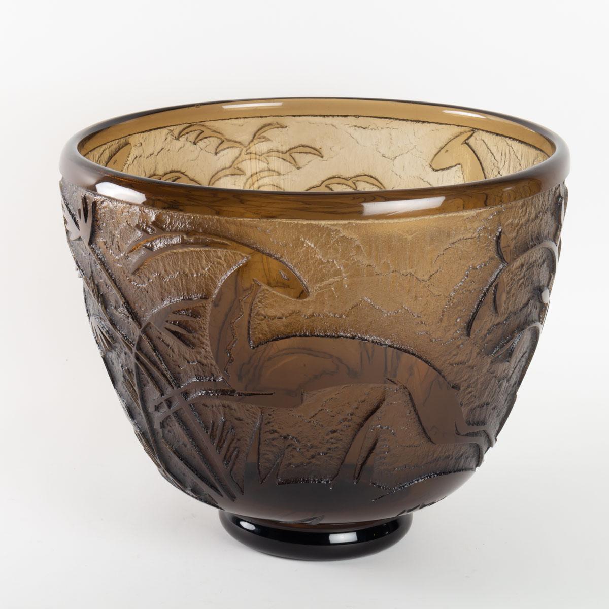 Exceptional monumental glass vase made by Daum in 1930s in topaz acid etched glass with a design of antelopes in foliage. 

Engraved 