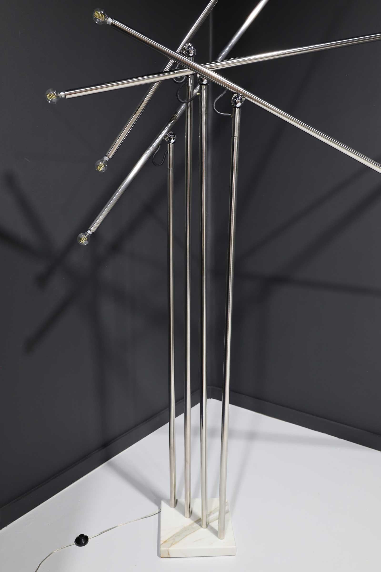Chromed steel with four adjustable arms. Marble base. Made in Italy.