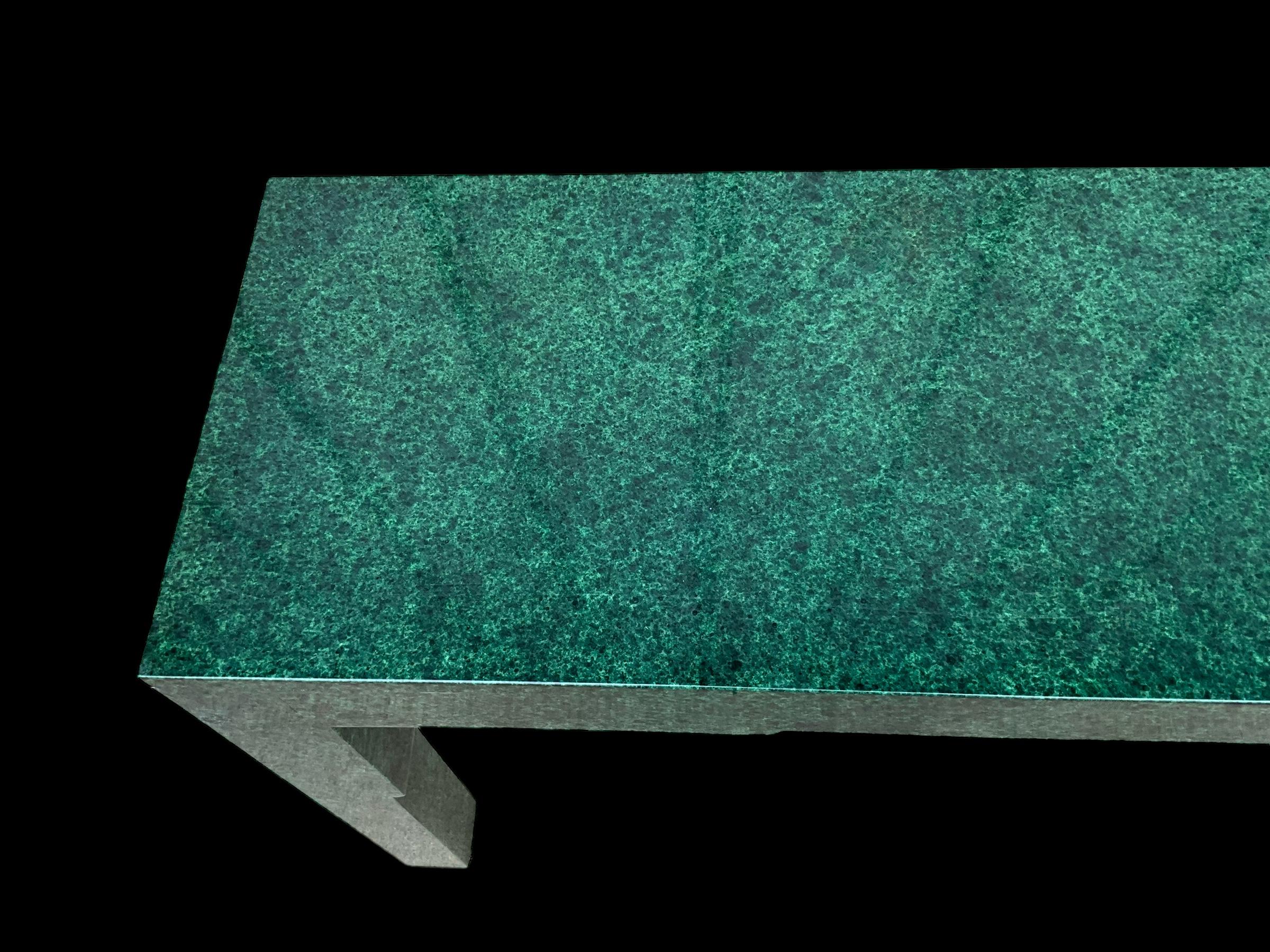 This is a monumental modern console table with a faux malachite finish. It is done in the manner of James Mont, who had a flare with mixing Asian and modern sensibilities. It is in very good condition.

My shipping is for the Continental US only and