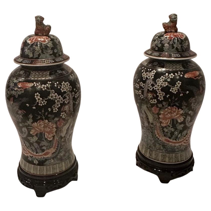 Monumental Asian Palace Jars with Foo Dog Finials and Ebonized Stands en vente