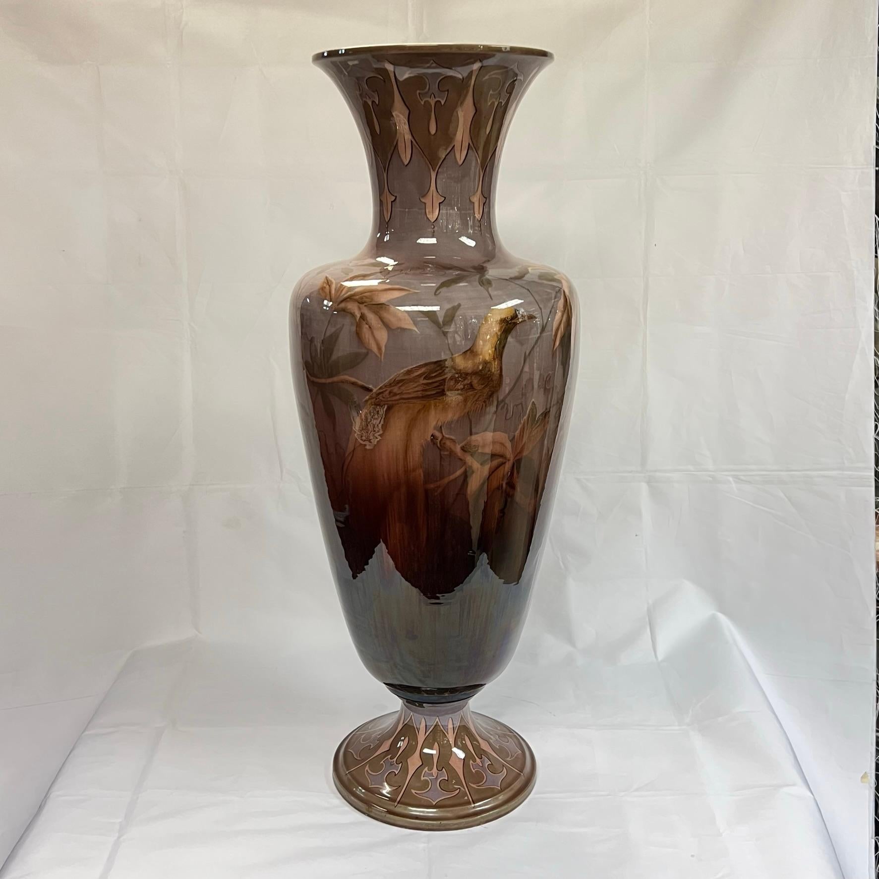 Monumental Art Nouveau period ceramic vase by the Austrian firm of Gerbing and Stephan, circa 1890s, measuring 32.5 inches and depicting exotic birds, finely painted and glazed.  Underside stamped F&AG, the mark the firm adopted in the early 1890s. 