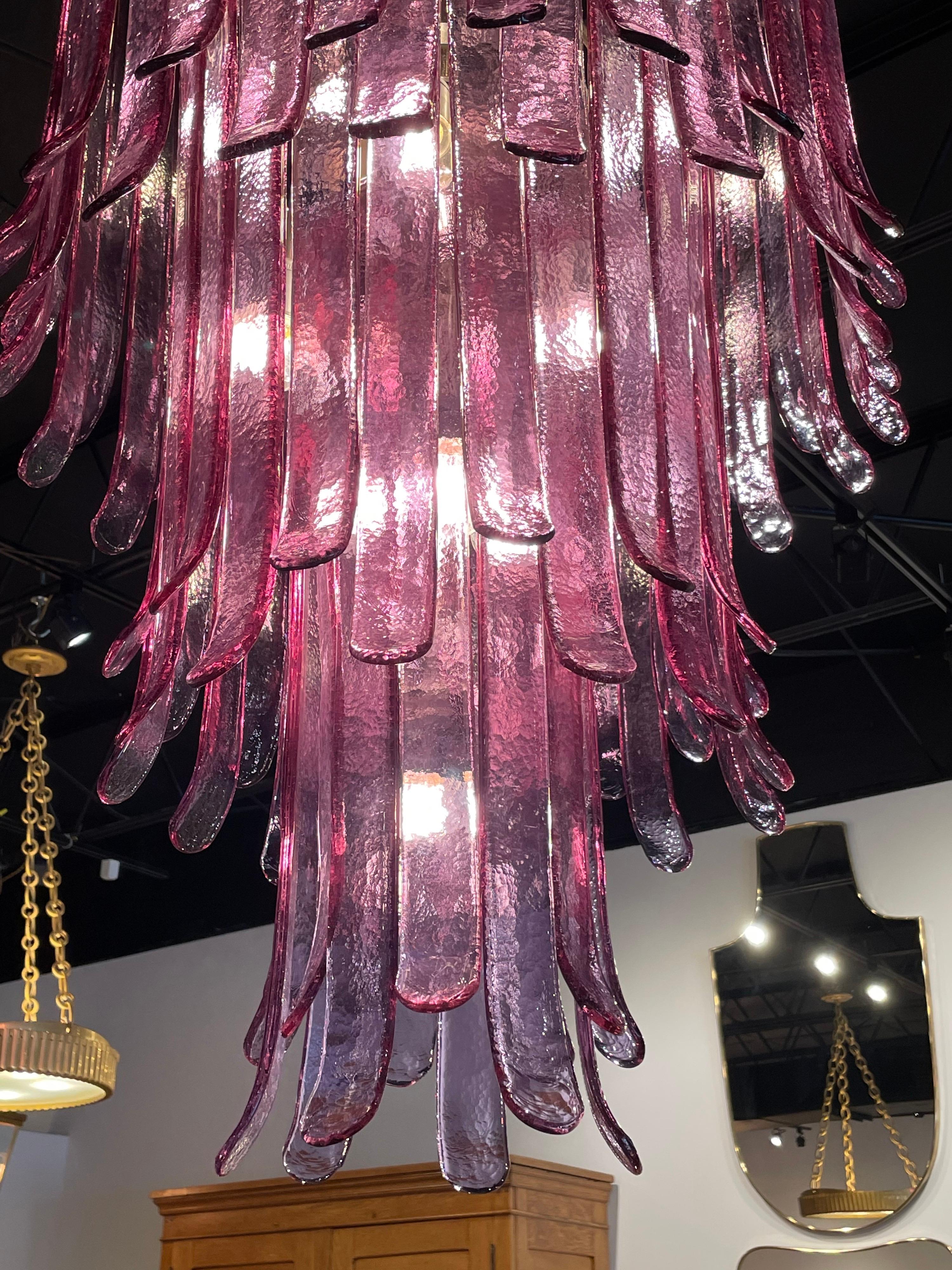 This is a magnificent and oversized Vintage 3-Tier lilac Murano glass chandelier by Mazzega, Italy. Glass pieces in a beautiful lilac/purple hue.
Note: ONLY ONE AVAILABLE.