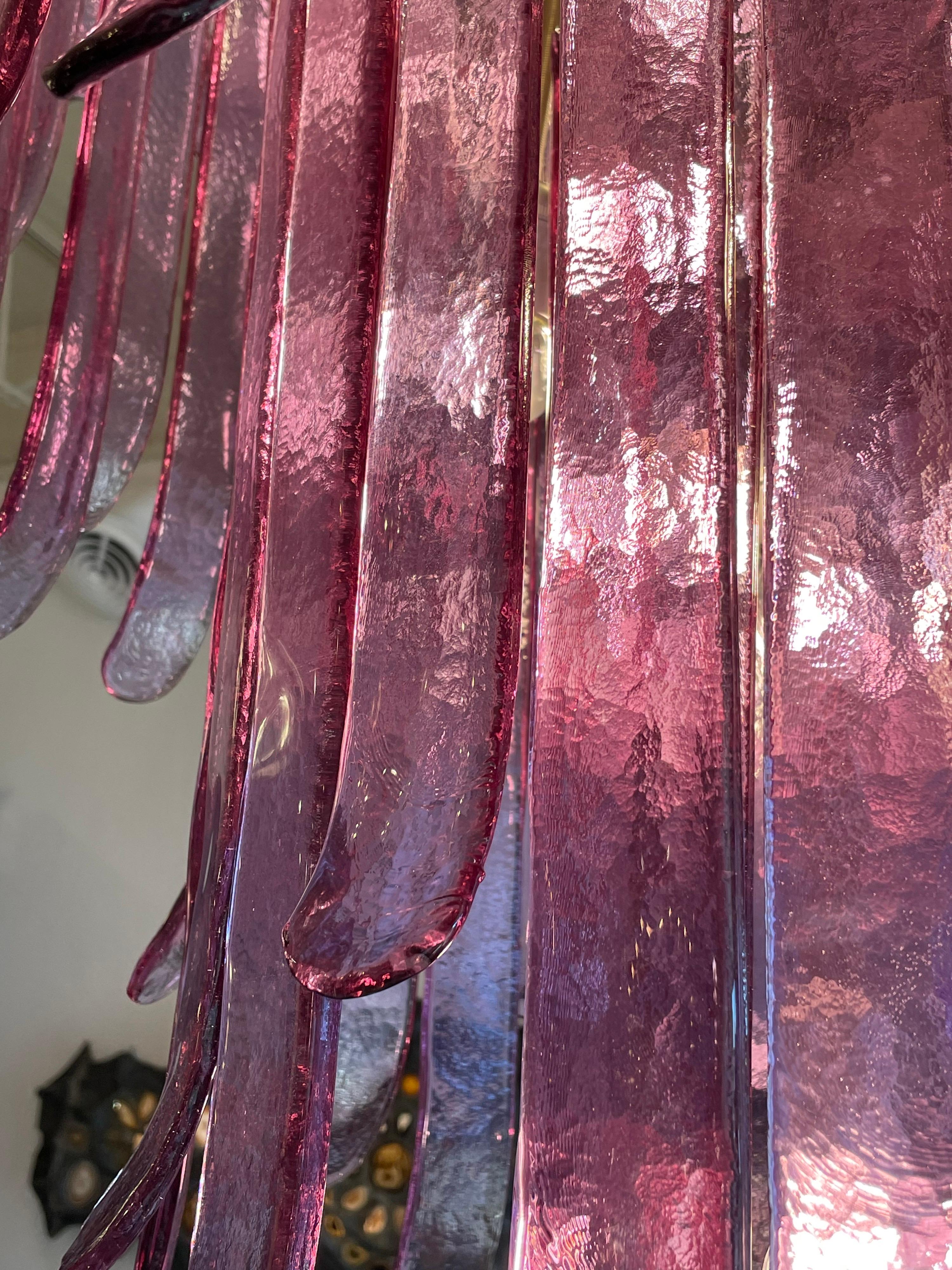 This is a magnificent and oversized VINTAGE 4-Tier lilac Murano glass chandelier by Mazzega, Italy. 31 lights and 133 individual glass pieces in a beautiful lilac/purple hue. 
Note: We have a smaller one also available.  See our other listings.

