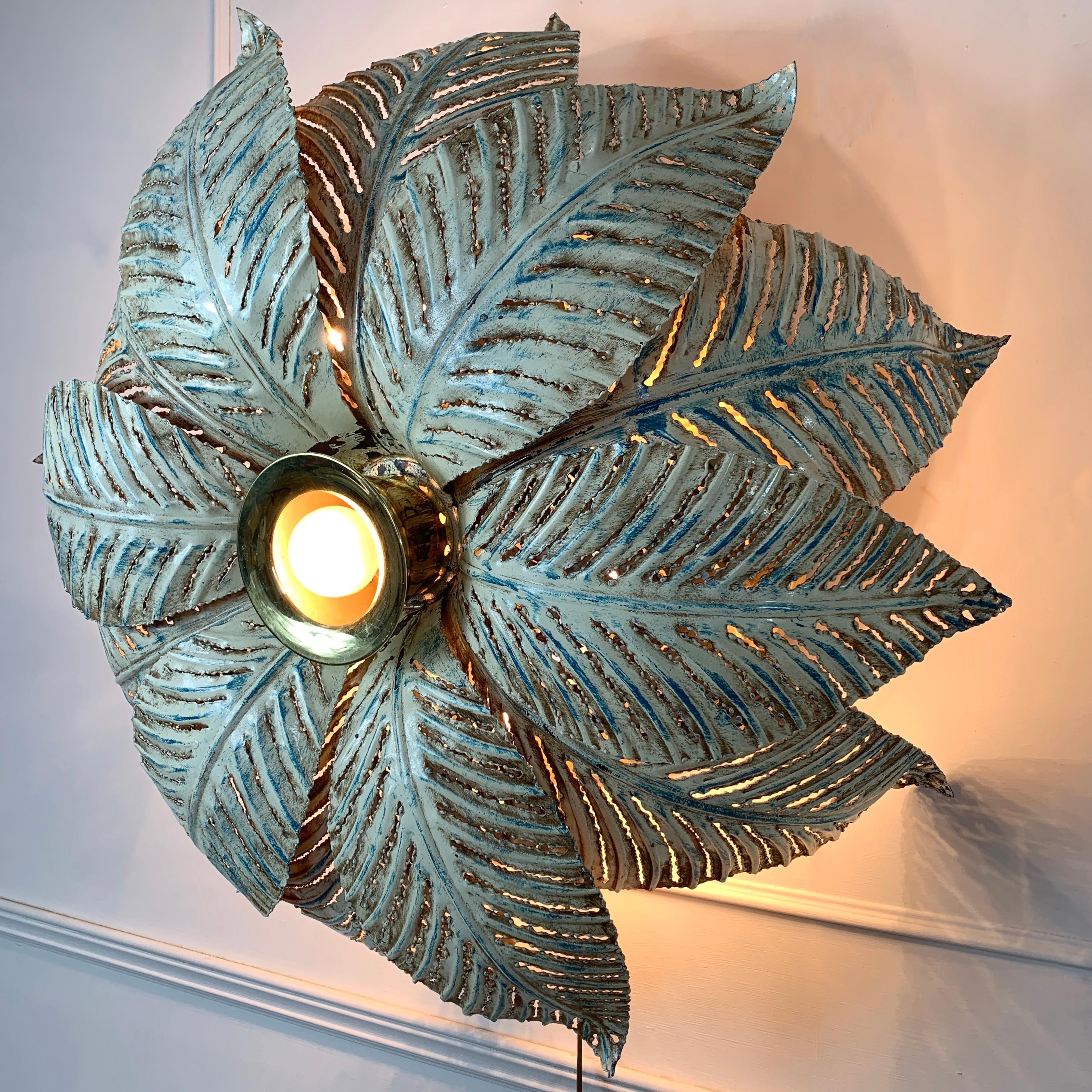 An exceptional Banci Firenze ceiling flush mounted light, dating from the 1980s. This is an extremely rare light from the iconic Banci lighting company, of huge proportions, enormous individual palm leaves sit over 12 E14 bulb holders, with one main