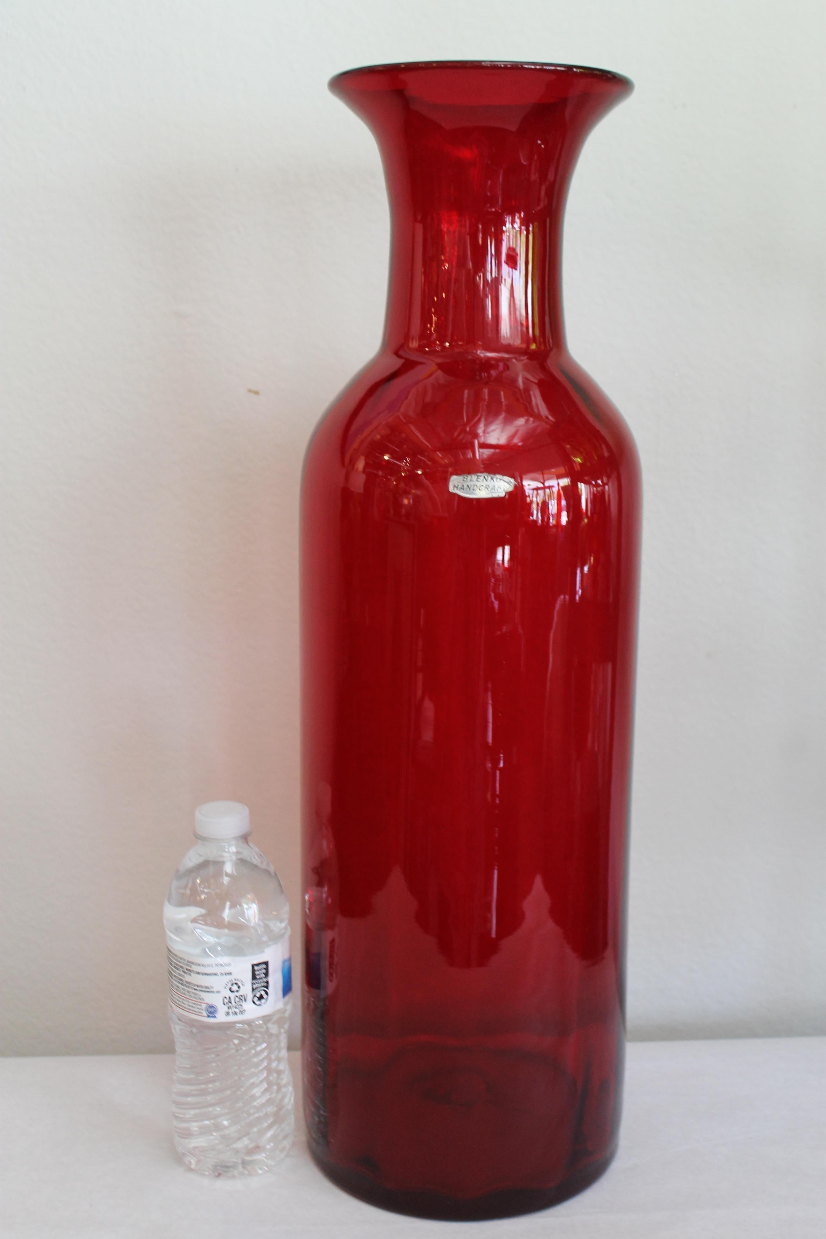 Architectural Blenko tangerine floor vessel/bottle by Wayne Husted. Bottle is 20.25