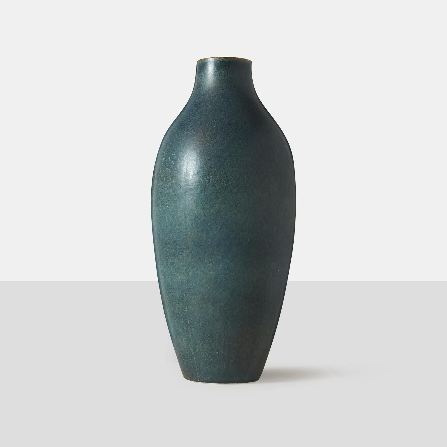 A large scale vase with a hare’s fur glaze in shades of blues and greens by Carl-Harry Stalhane for Rorstrand.
Incised signature and studio mark to underside: [R Sweden CHS SDA].