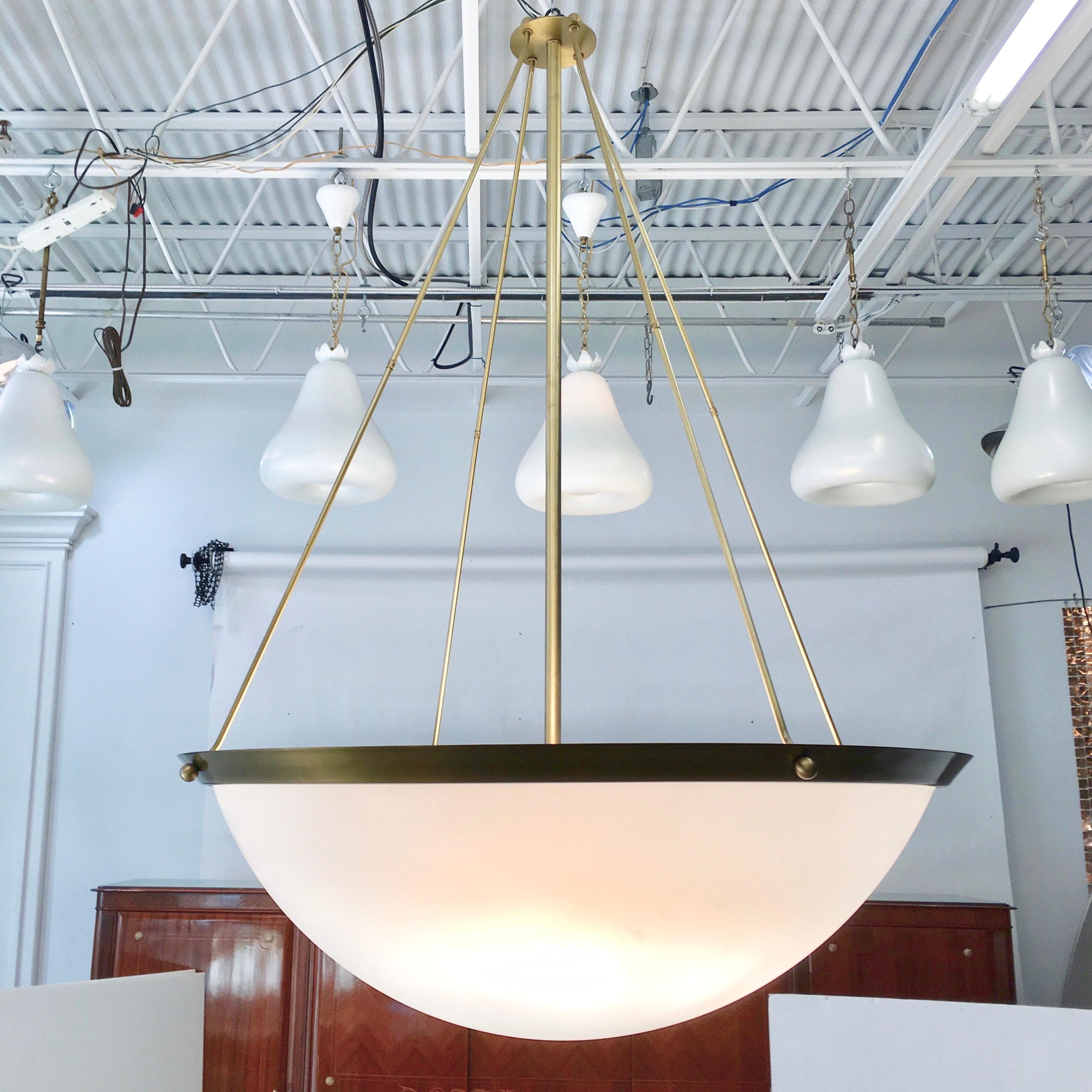 Custom fabricated Art Deco style inverted dome pendant fixture, over 5 feet high and nearly 4 feet diameter, made of solid brass with a bronzed lacquer finish and a satin finished acrylic dome. Left over from a lighting renovation project for an