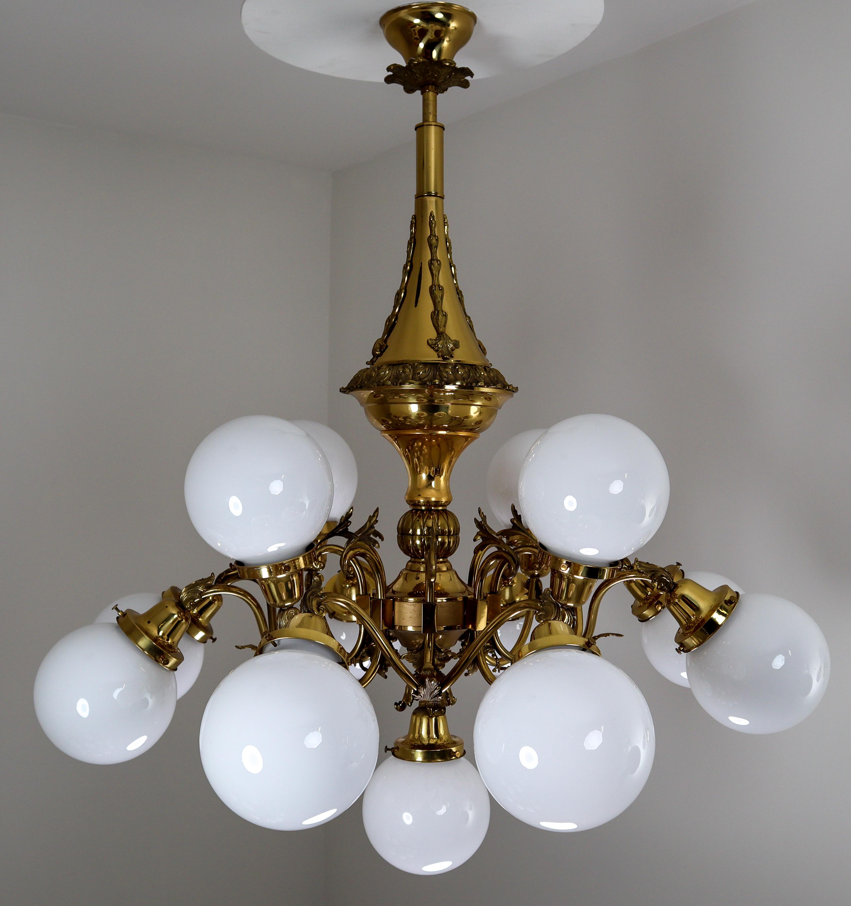 Five monumental brass chandeliers with opaline glass globes from the National Gallery Praque.

Monumental and chic design set of five chandeliers with high quality brass fixture and luxury opaline glass globes. These chandeliers with brass frame