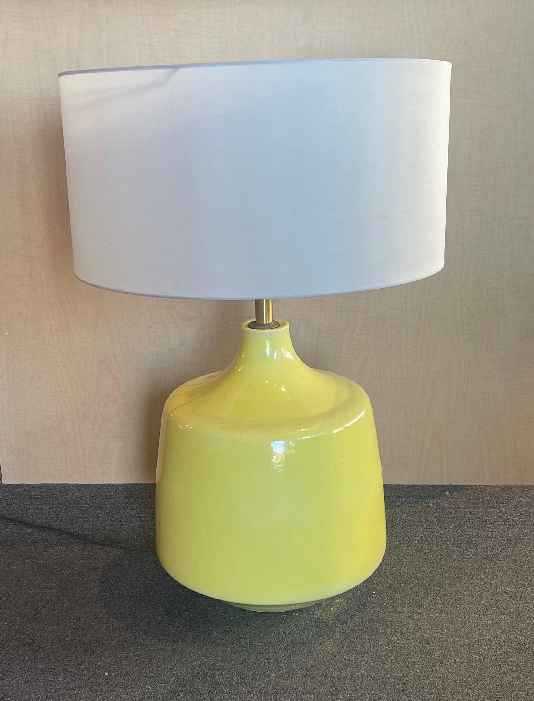Monumental bright yellow glazed ceramic studio pottery table lamp, circa 1960s. The lamp is massive measuring 13.5
