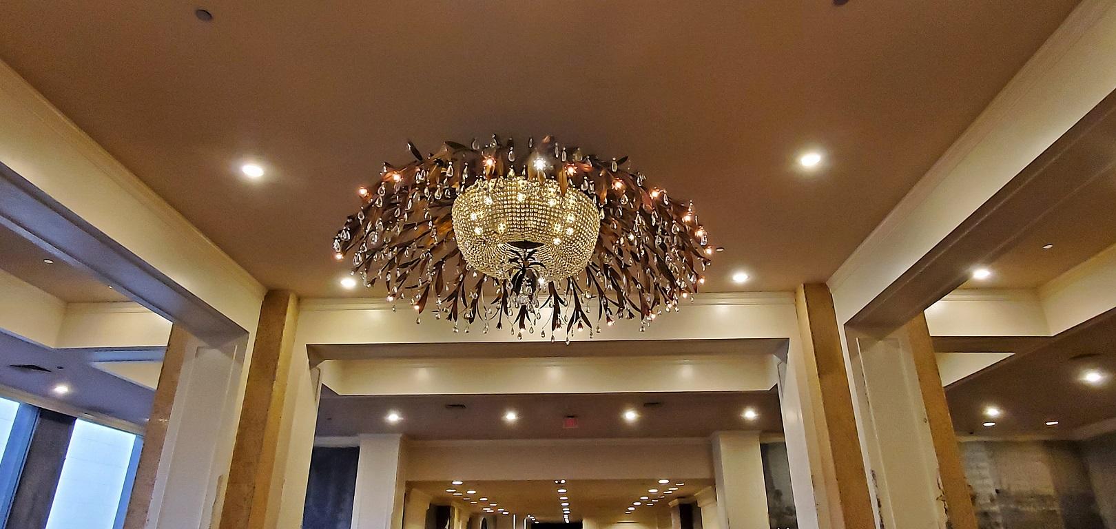 We have the distinct pleasure to present to you a monumental bronze and floral crystal chandelier with amazing provenance.

From The Foyer Of The Regency Ballroom Of The Fairmont Hotel In Dallas, Tx – One Of The Most Iconic Hotels In Dallas
This