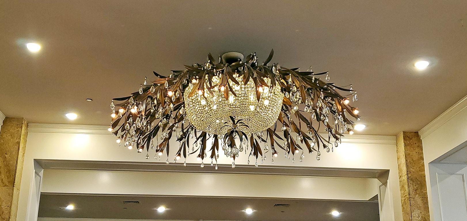 Monumental Bronze and Floral Crystal Chandelier with Provenance In Good Condition In Dallas, TX
