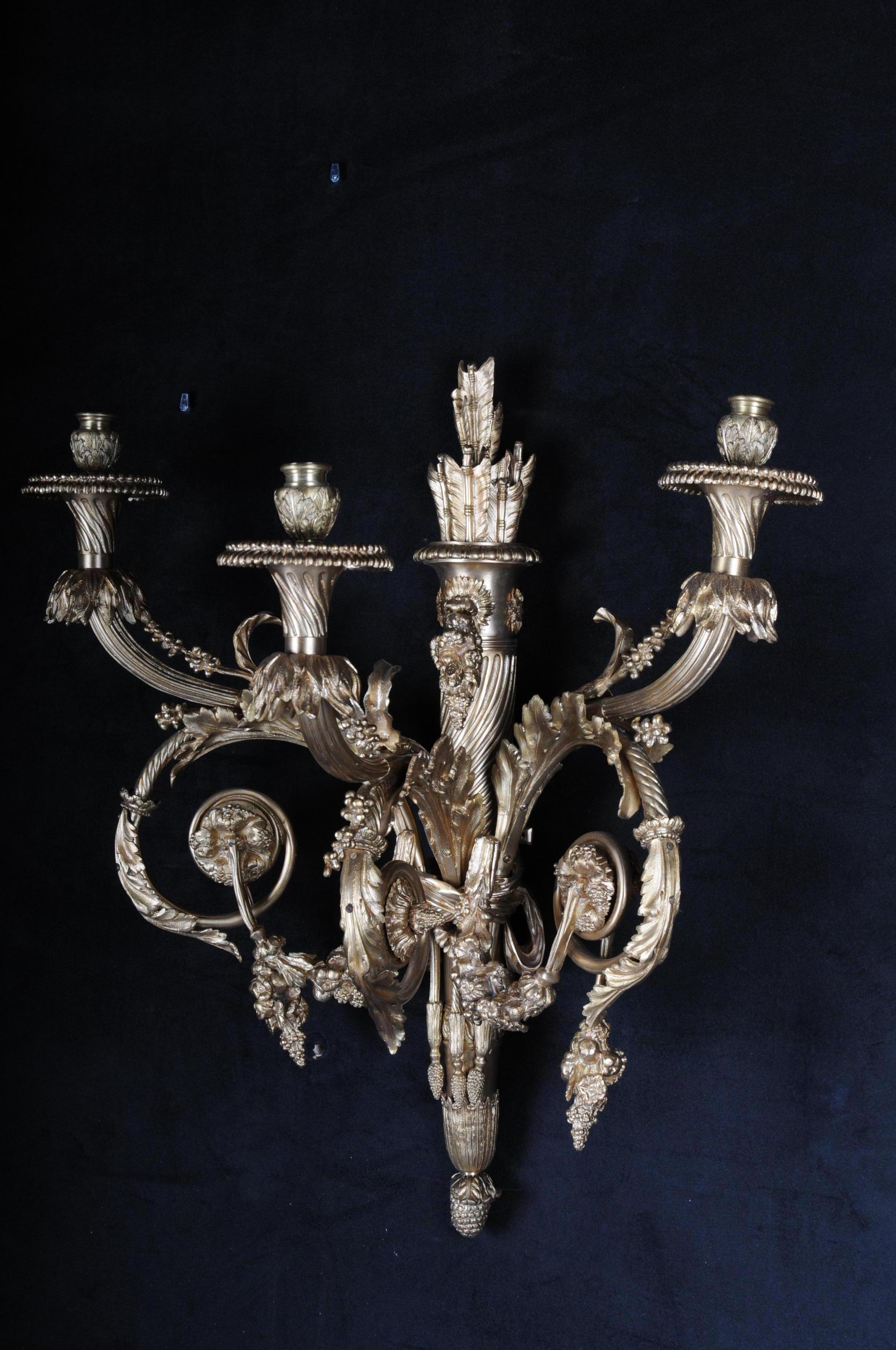 Exceptional finely chased and cast bronze. Conically ascending column shaft starting from 3 acanthus-like curved lighthouses. Vase-shaped grommets on a domed grommet.
The entire candlestick is made in a very elaborate handcraft. This model is one