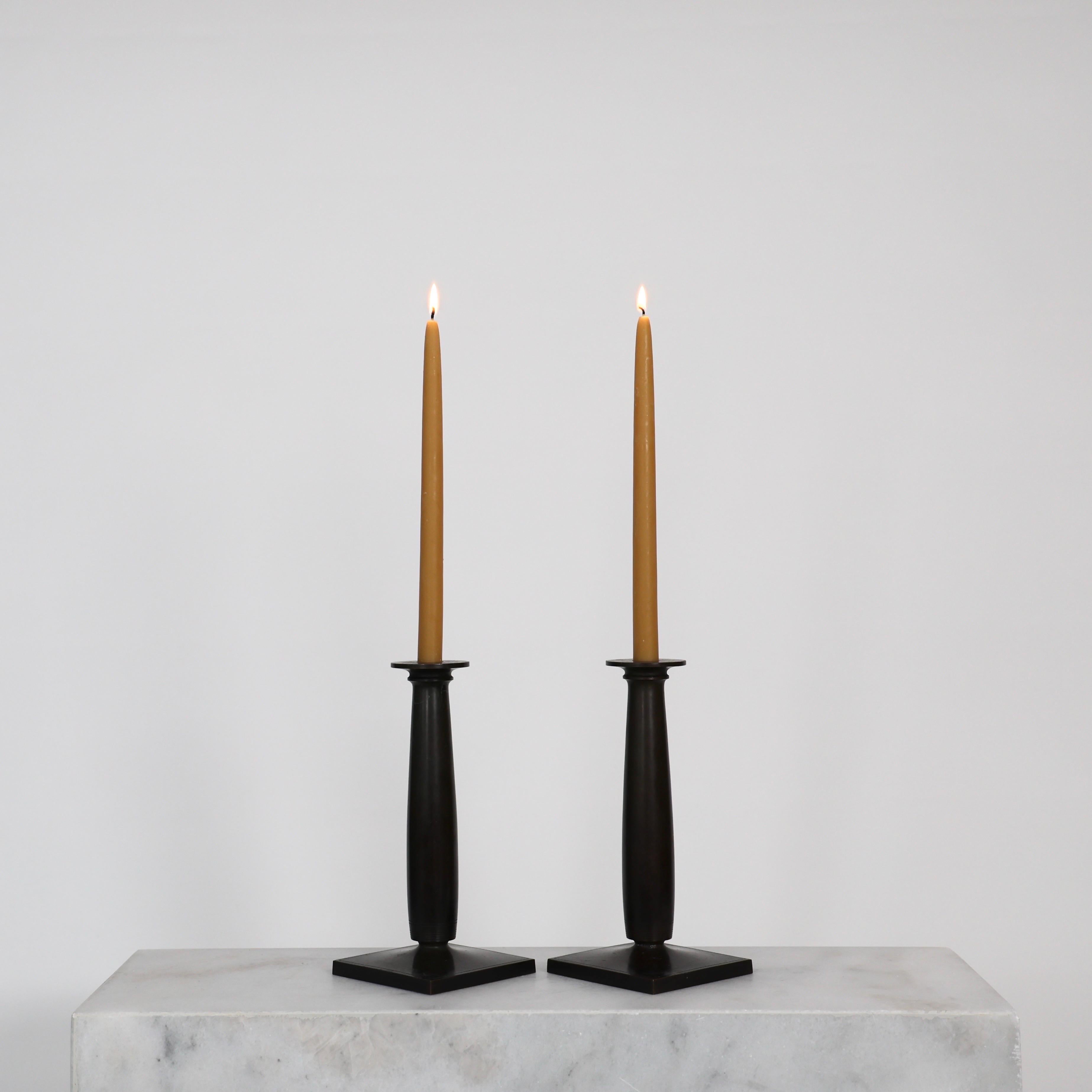 Set of Monumental Bronze Candleholders made by Just Andersen in the 1920s. An impressive set for an exquisite home.

* Pair of Tall Bronze Candlestick Holders
* Manufacturer: Just Andersen
* Style: B155
* Year: 1925-1930
* Condition: Very good