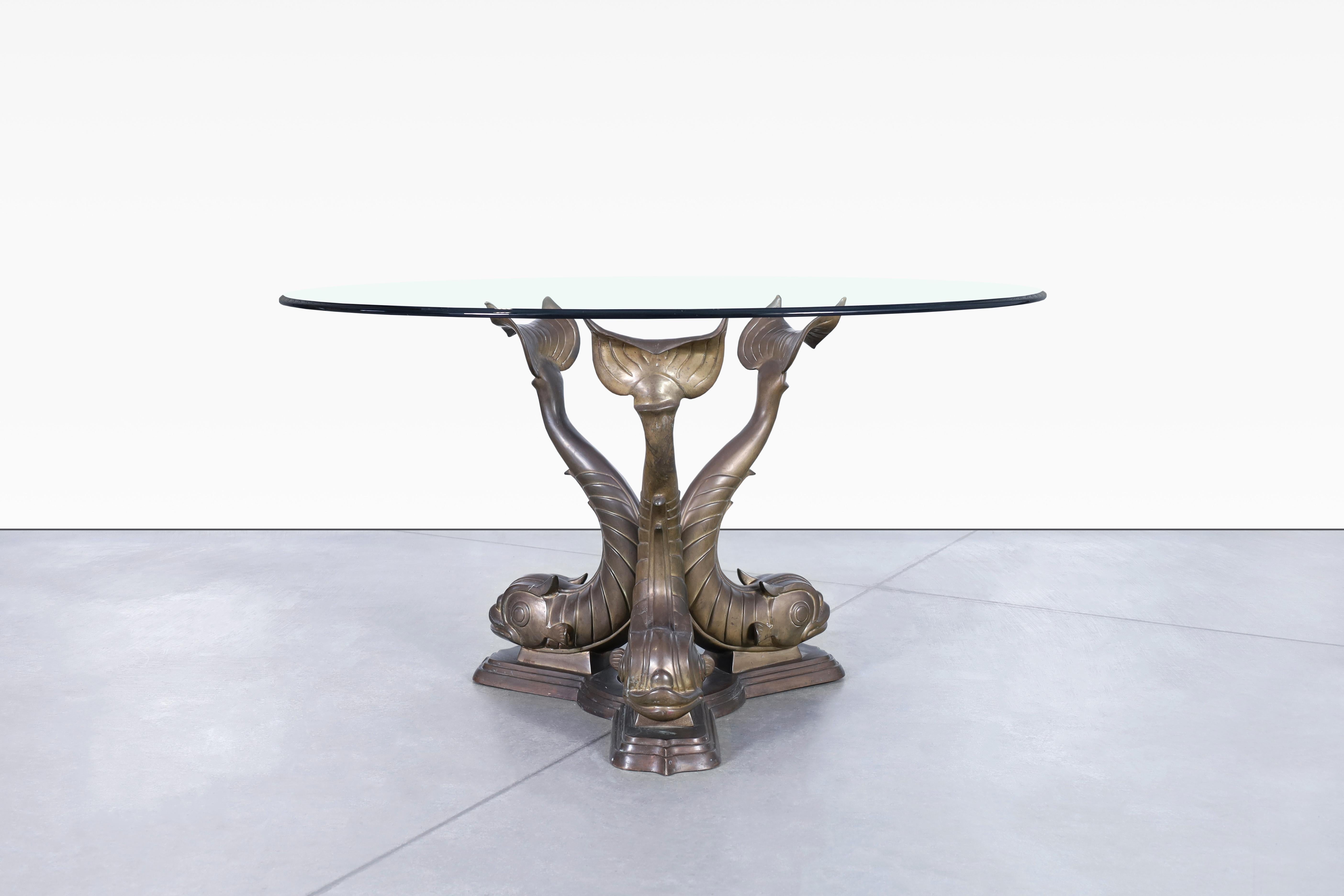 Vintage bronze koi fish dining table designed in Italy, circa 1970s. Feast your eyes on this exquisite table that showcase a sturdy bronze base sculpted beautifully in a koi fish design. The intricacy of the detailing on each koi fish sculpture is