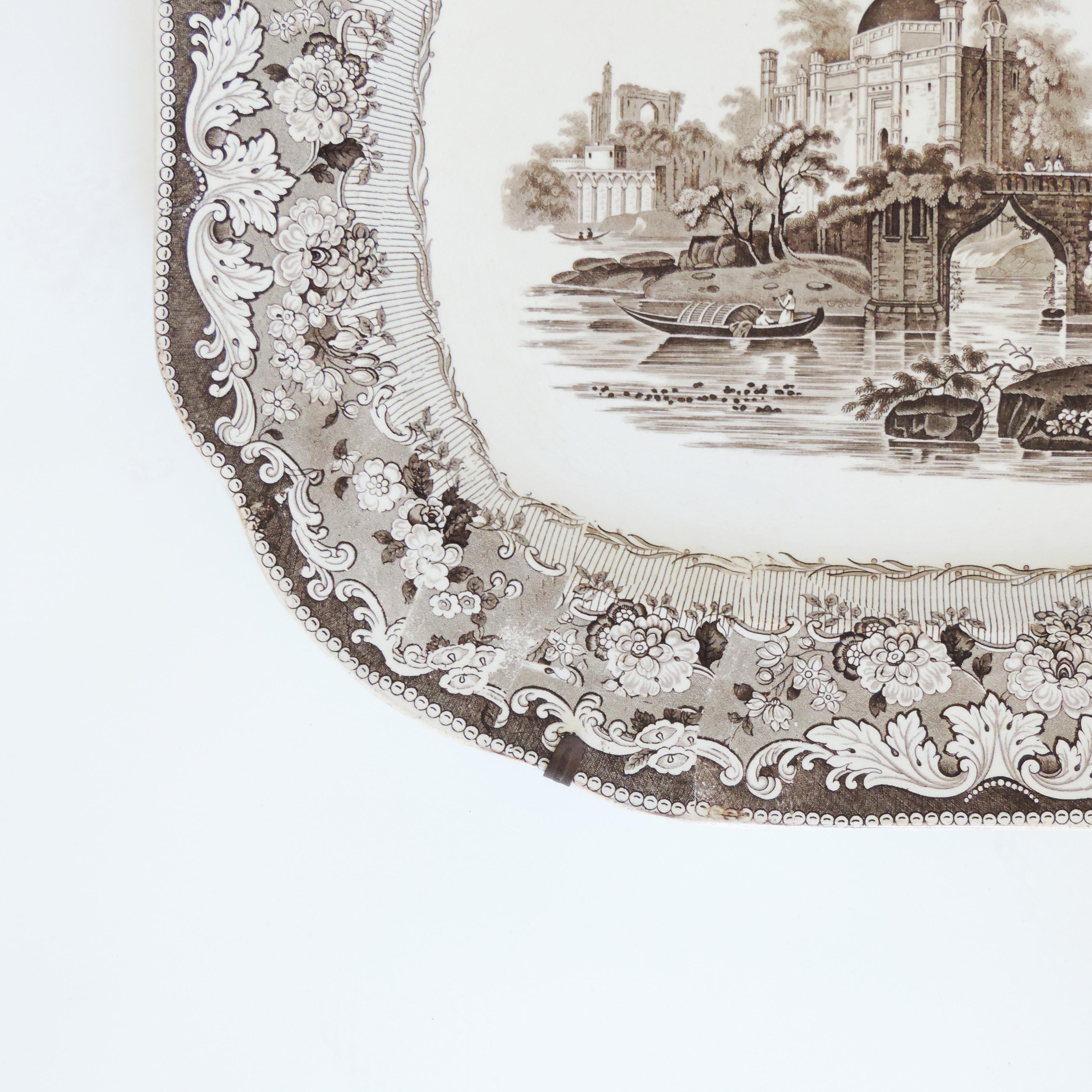 Monumental brown transferware serving plate, England, 1880s
With original hanging wires.