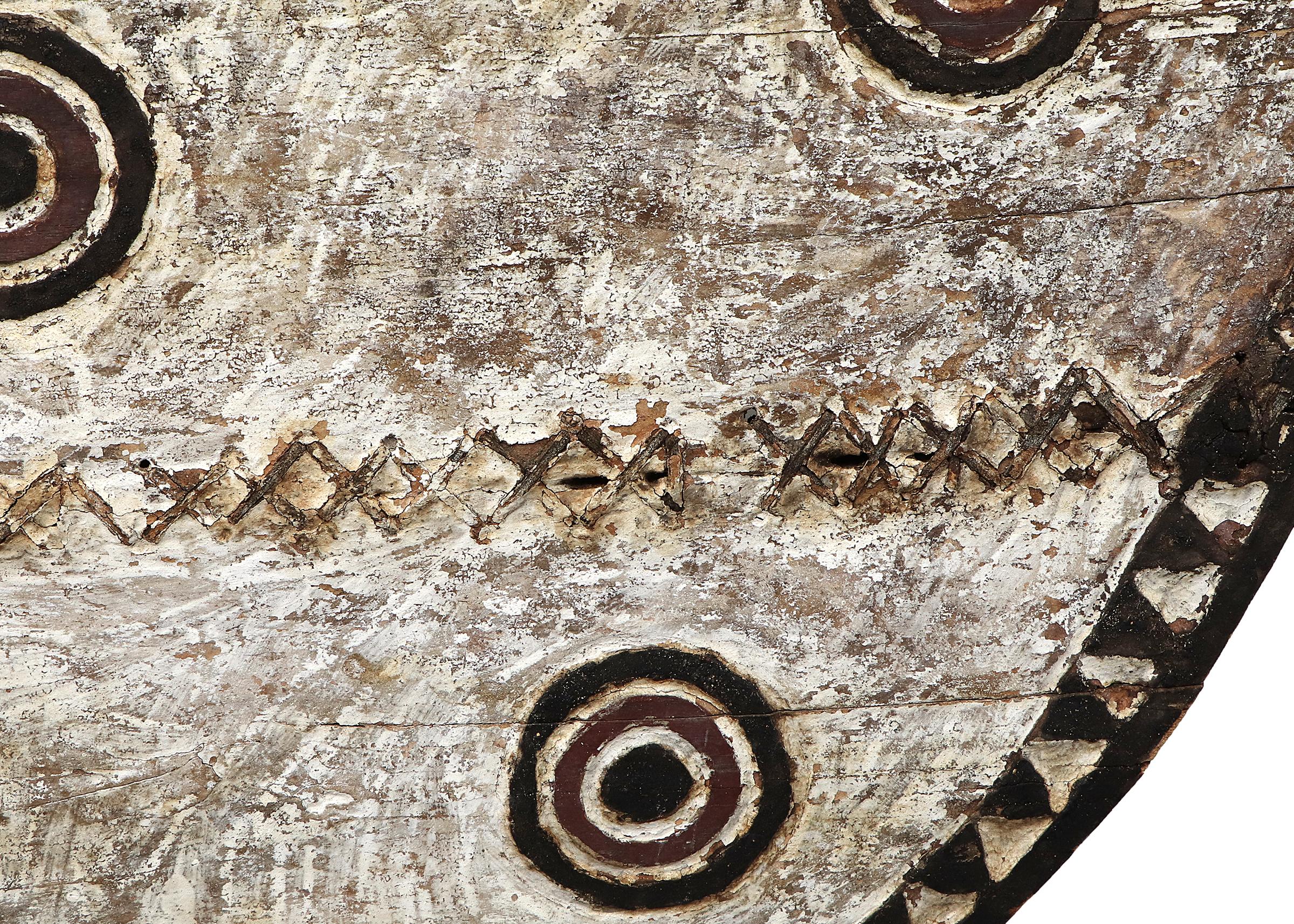 This striking ceremonial Hawk Moth mask is a powerful example of traditional Bwa artistry from Burkina Faso, West Africa. Hand-carved from a single piece of wood and painted with bold, geometric patterns using natural pigments, the mask measures an