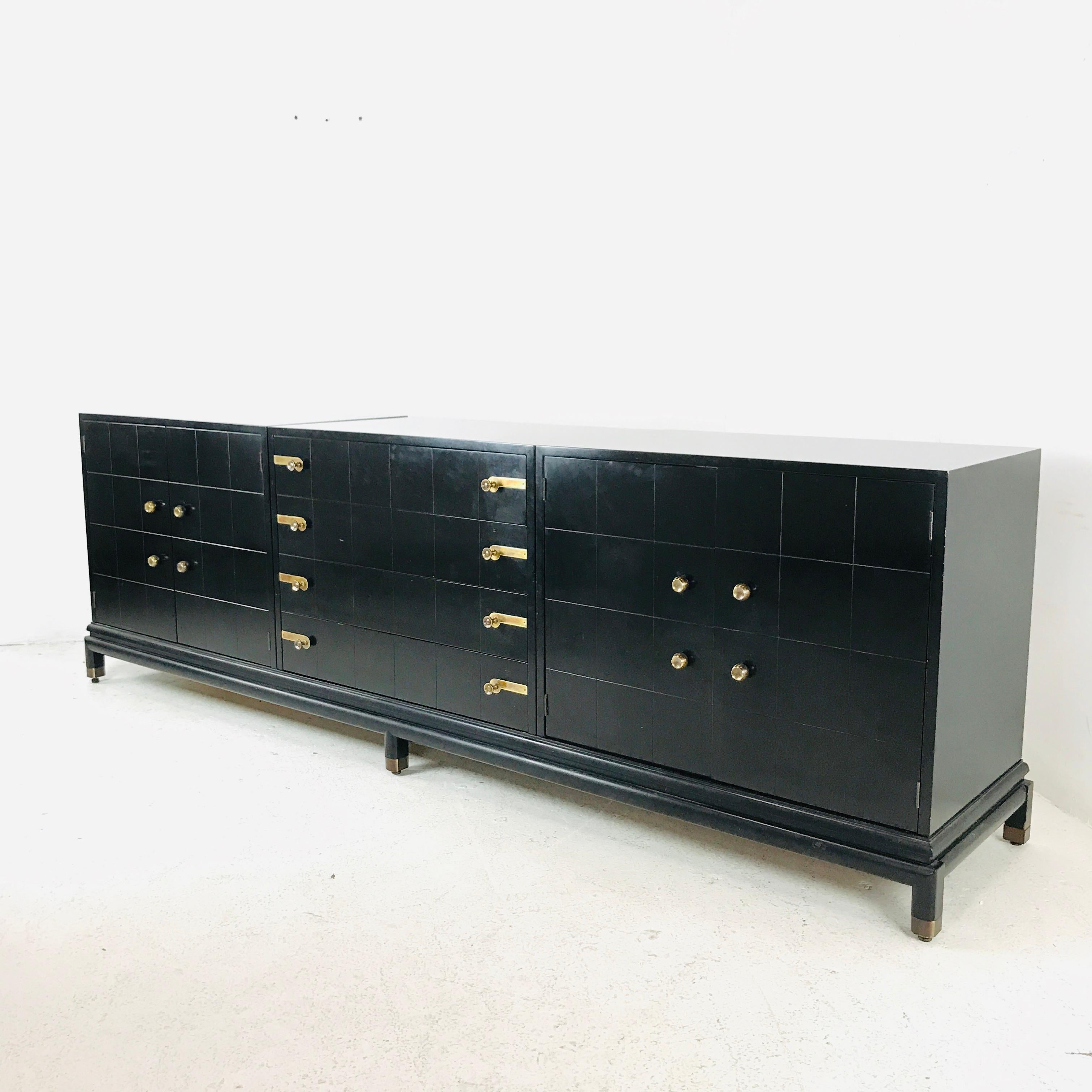 A stunningly sophisticated design from the 1950s. This timeless beauty was designed by Renzo Rutili for Johnson furniture company. The construction of this piece is solid wood, it is over built like a tank.