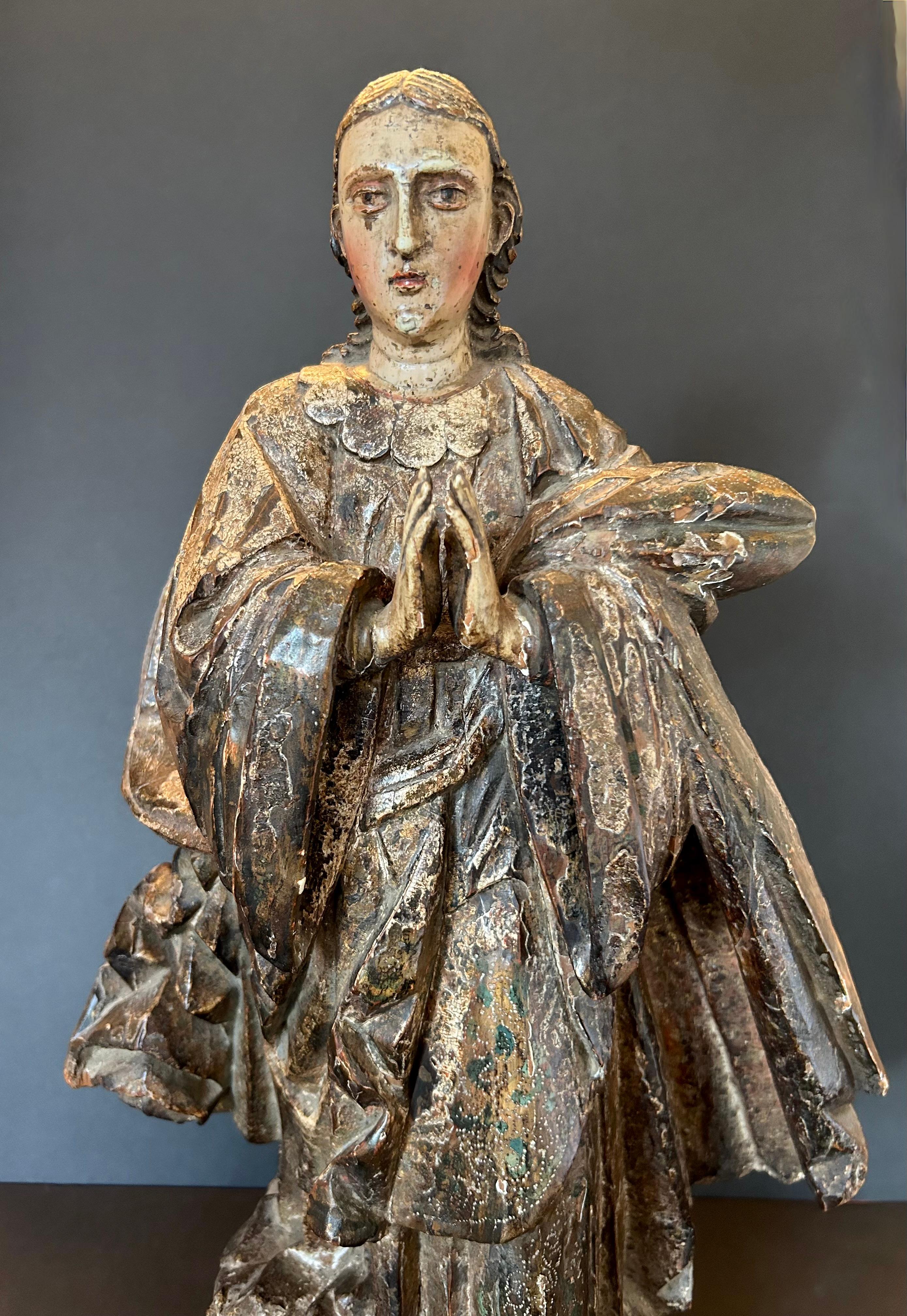 A stunning polychrome figure of a Saint from the late 18th century or early 19th century, from France. This is one of the most beautifully carved Saints we have ever featured, with the figure draped in glorious robes and a cape that falls