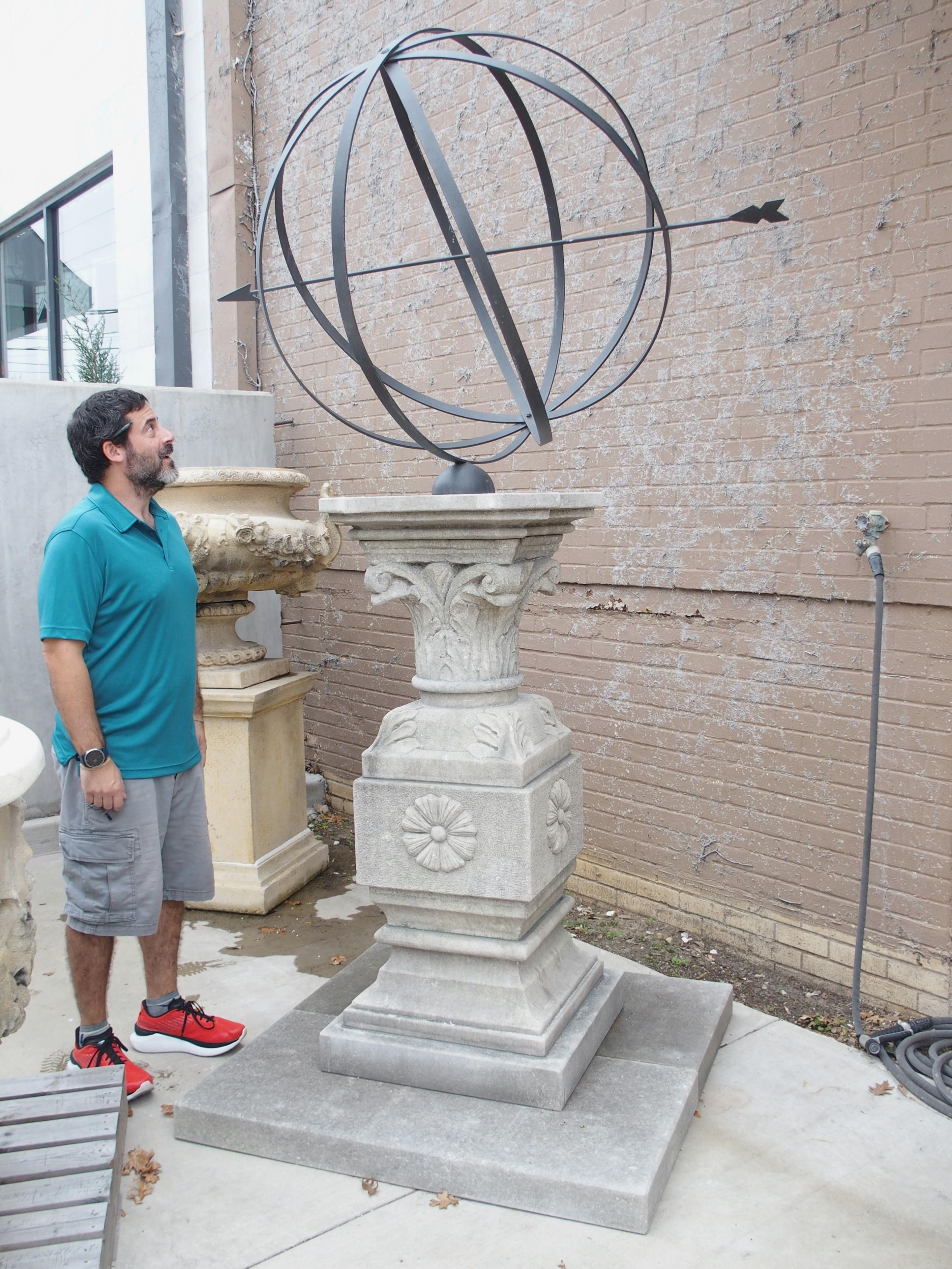 Standing at over eight feet tall (99.5 inches!), this monumental stone and iron armillary sundial was hand-carved in Italy. The four-ring armillary sphere has a central arrow gnomon that measures roughly five feet long (the sphere itself has a