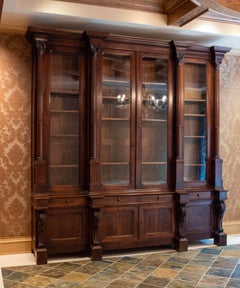 Monumental Carved Walnut English Victorian Two Piece Breakfront Bookcase