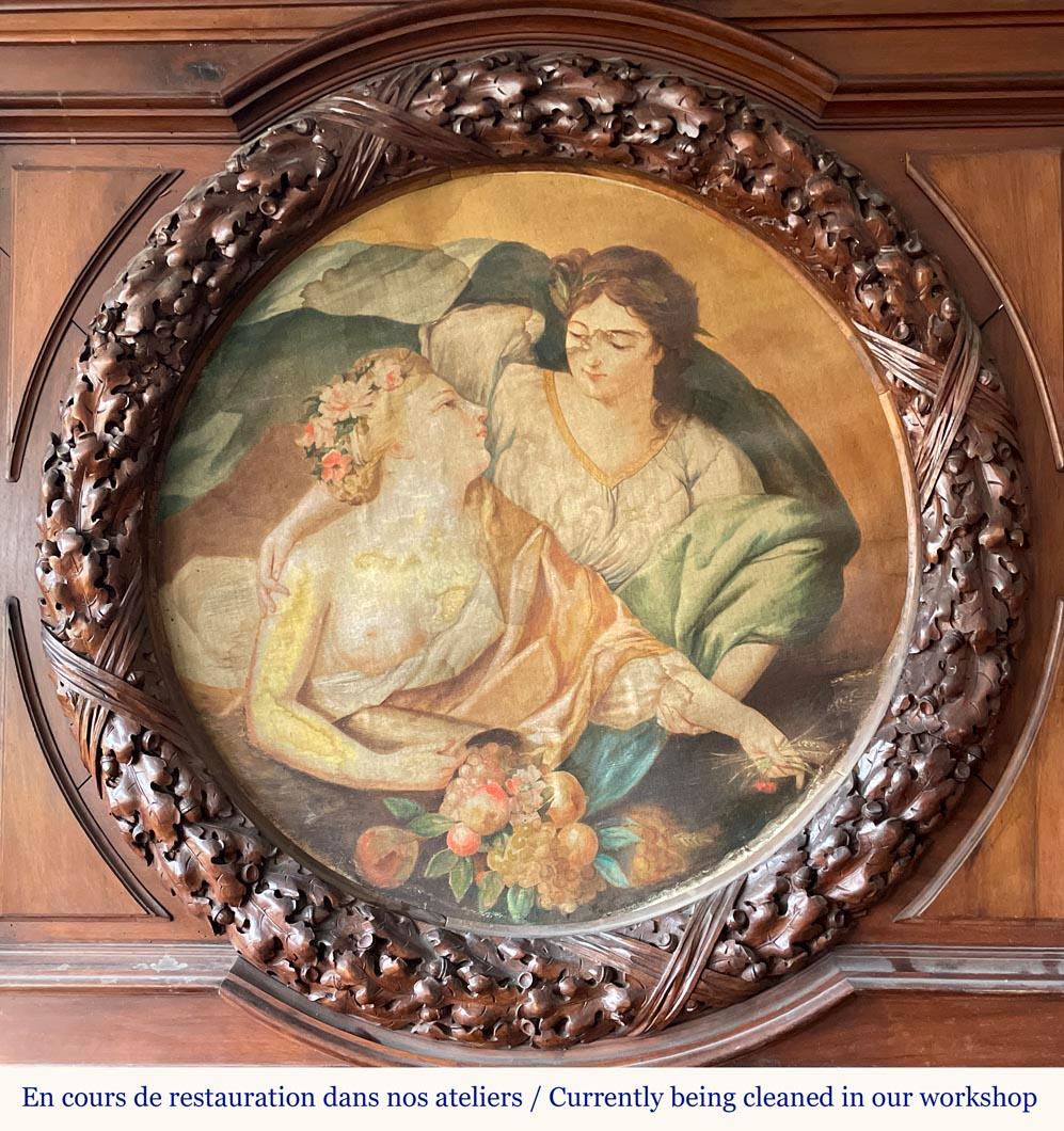Monumental carved walnut fireplace with atlantes and painted medallion Imposing ceremonial fireplace in solid walnut, richly carved in a Neo-Renaissance style. It features two full-round atlantes with powerful, expressive anatomies supporting the
