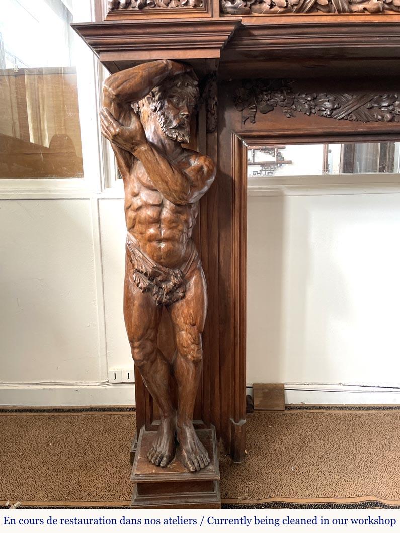 Walnut Monumental carved walnut fireplace with atlantes and painted medallion For Sale