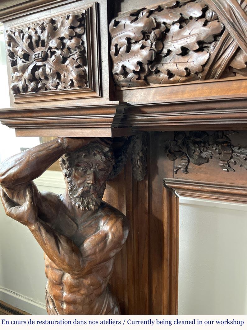 Monumental carved walnut fireplace with atlantes and painted medallion For Sale 1
