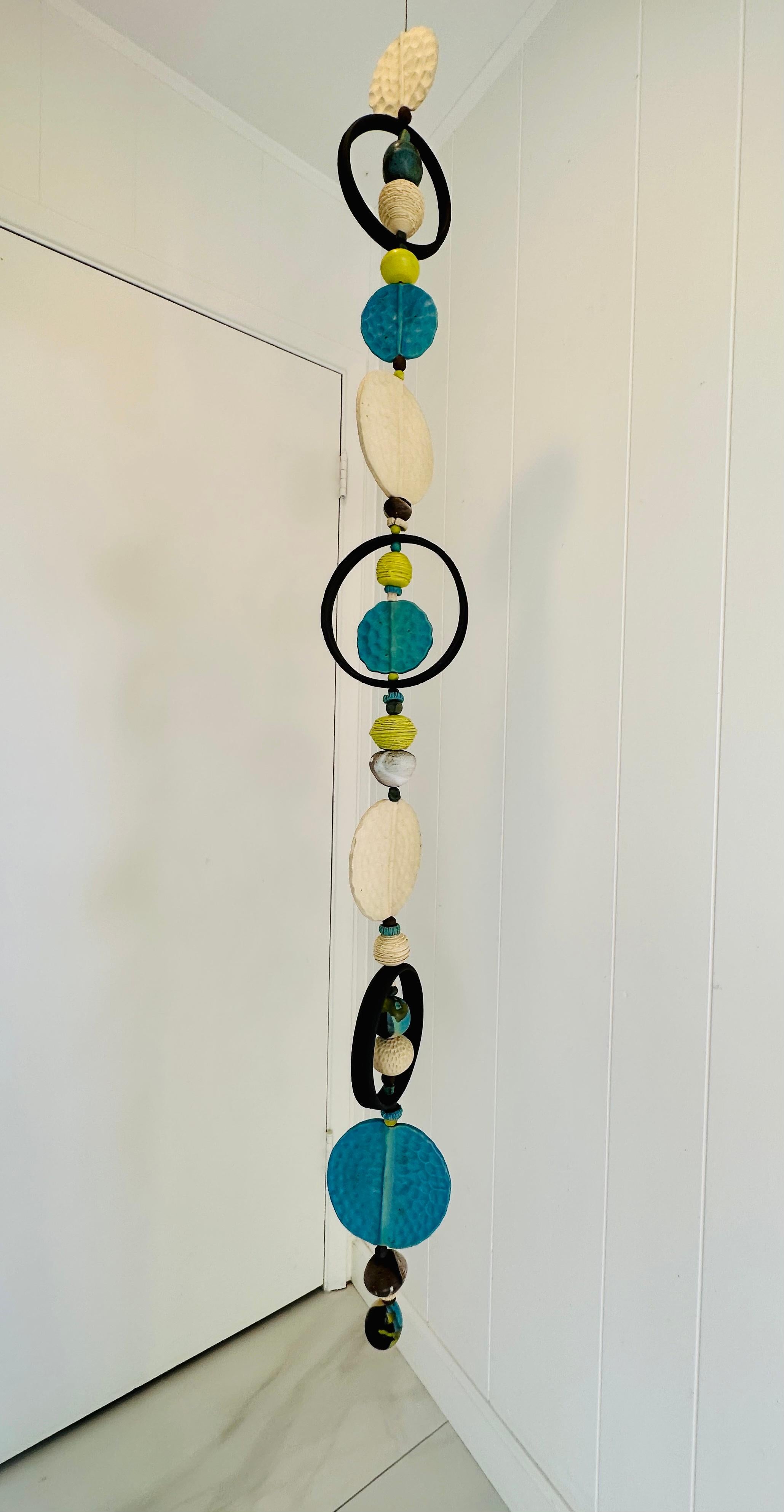 Gorgeous modernist architectural hanging ceramic sculpture by American artist , Brenda Williams.known for her craftsmanship with Cabat like feelies, totems, critters and sculptures, Brenda's unique textured shapes an d beads form an expressive Mid