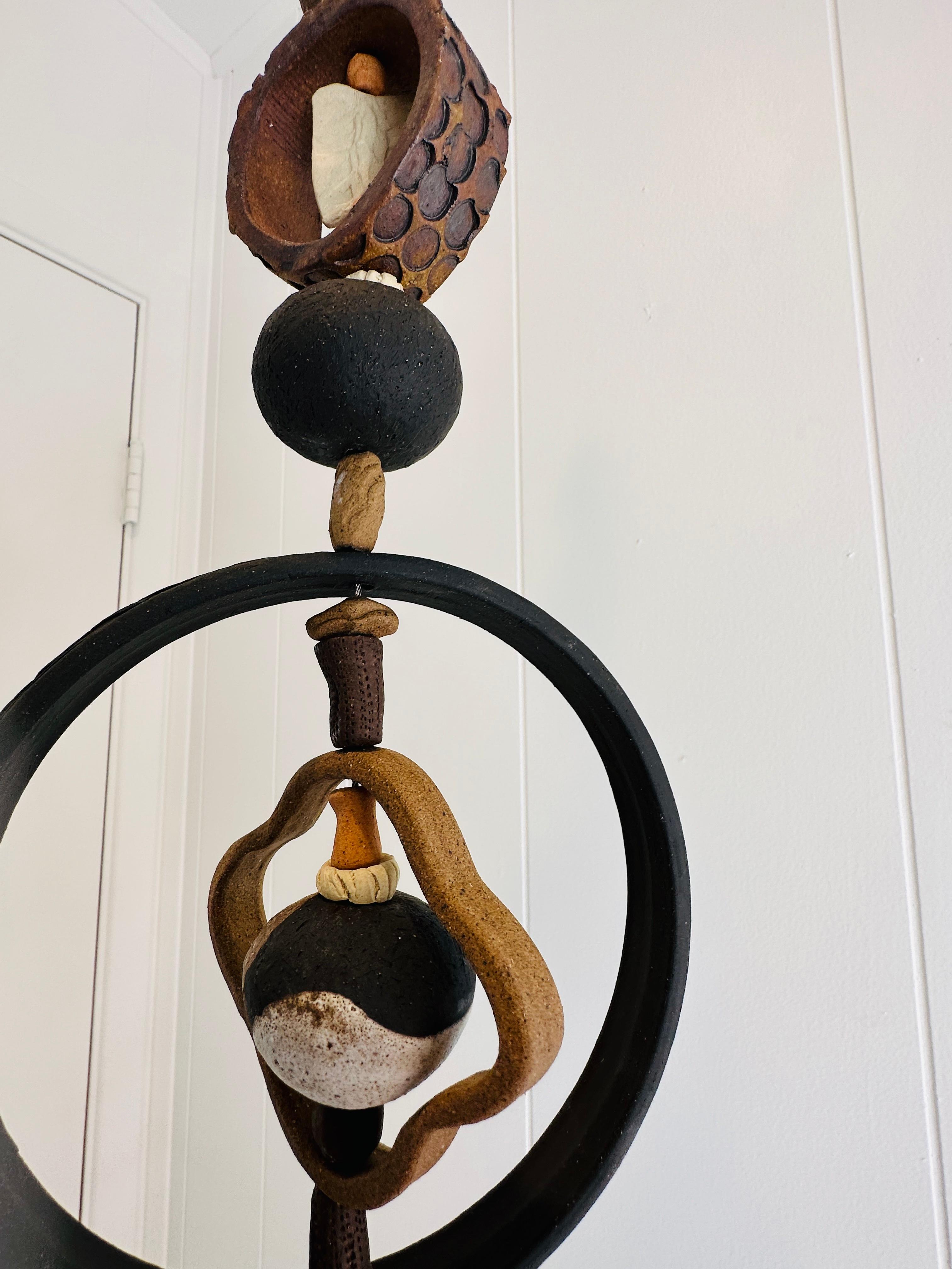 Contemporary Monumental Ceramic Kinetic hanging sculpture hand crafted by Brenda Williams For Sale