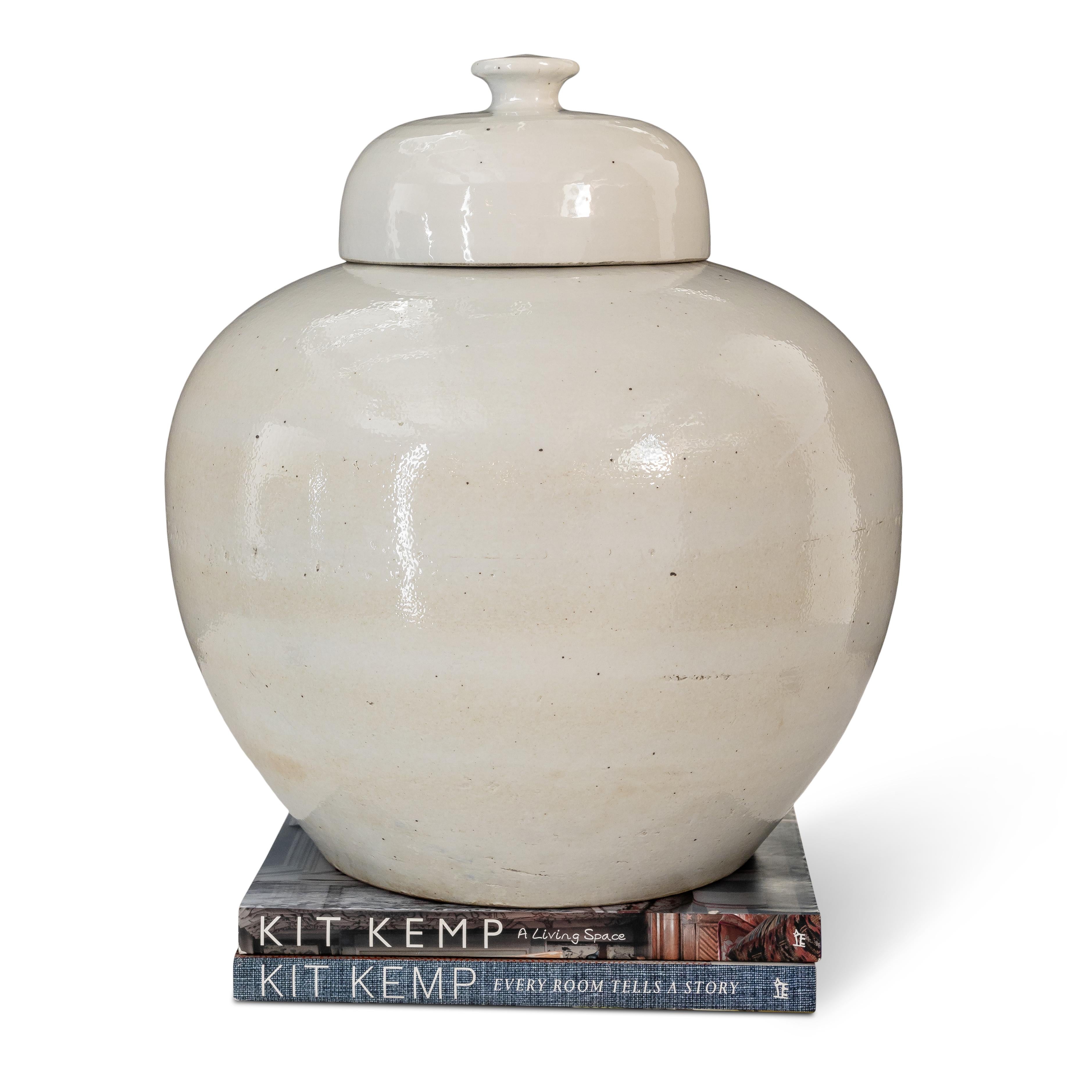 Large Chinese ginger jar and lid with a white and linen colored glaze.