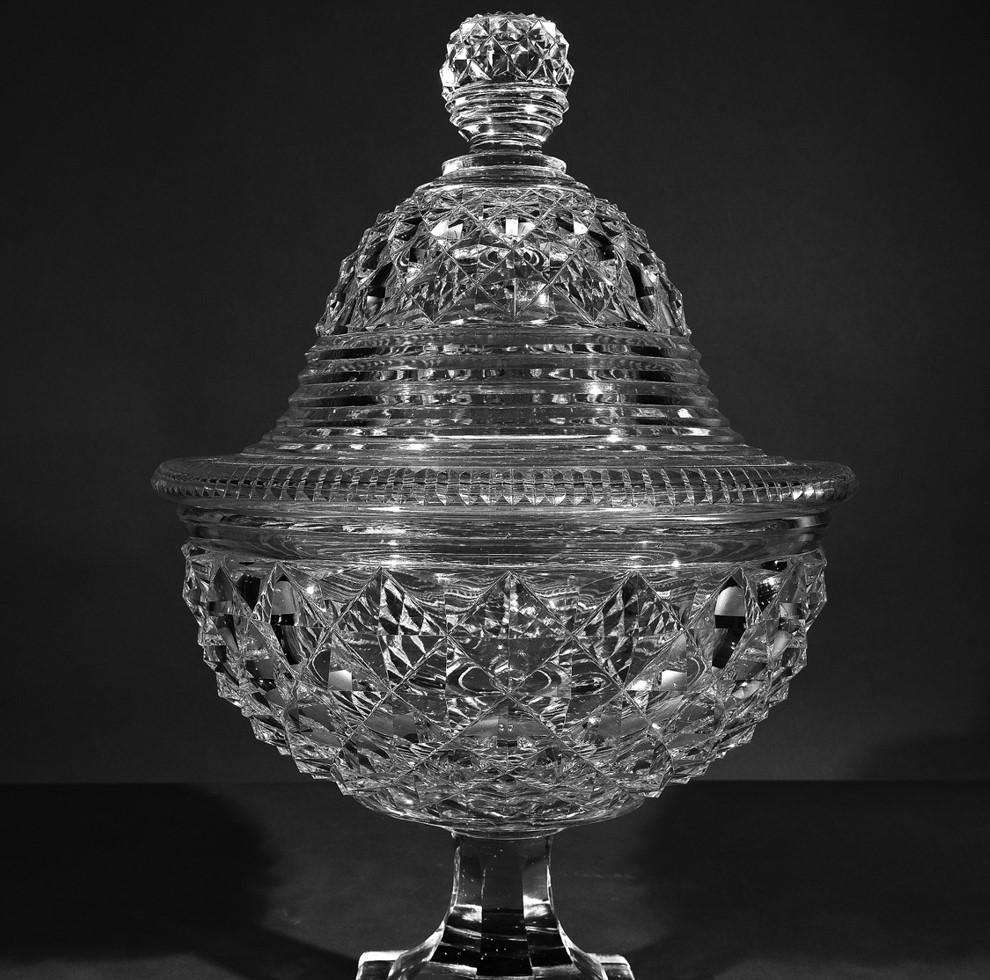 Monumental clear cut-glass covered compote, circa 1820.
La Cristallerie de Vonêche (active 1802-30), Belgium.
Glass, blown and cut.
Measures: 17 3/8 in. high, 11 1/4 in. diameter.

Compotes, known in French as coupes à fruits were a mainstay in