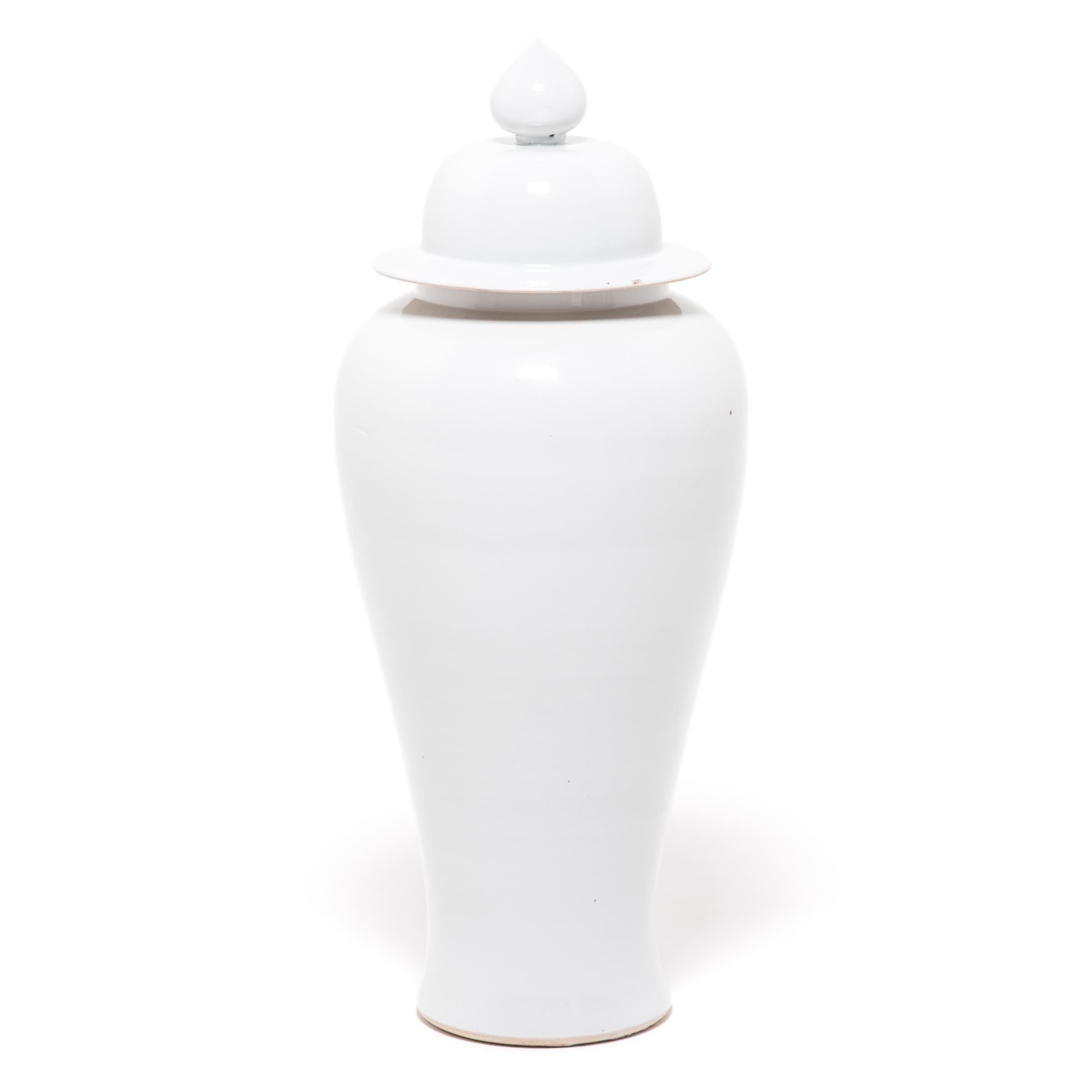 Defined by its rounded body, high shoulders and domed lid, the time-honored form of the Chinese ginger jar takes on a streamlined look in this contemporary interpretation made in China's Zhejiang province. Traditionally elaborately decorated, this