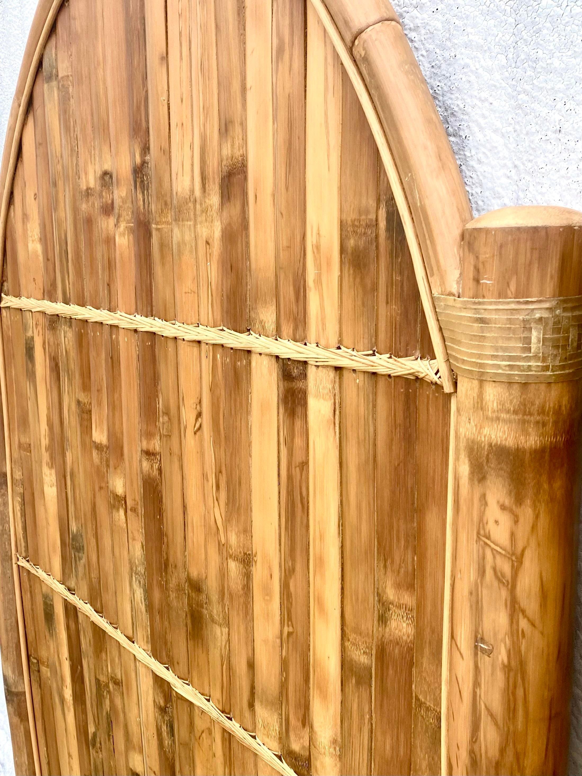 Huge and fantastic pair of vintage twin headboards. Chic high arch made from a heavy split bamboo. Wrapped leather at the joints. Acquired from a Palm Beach estate. less