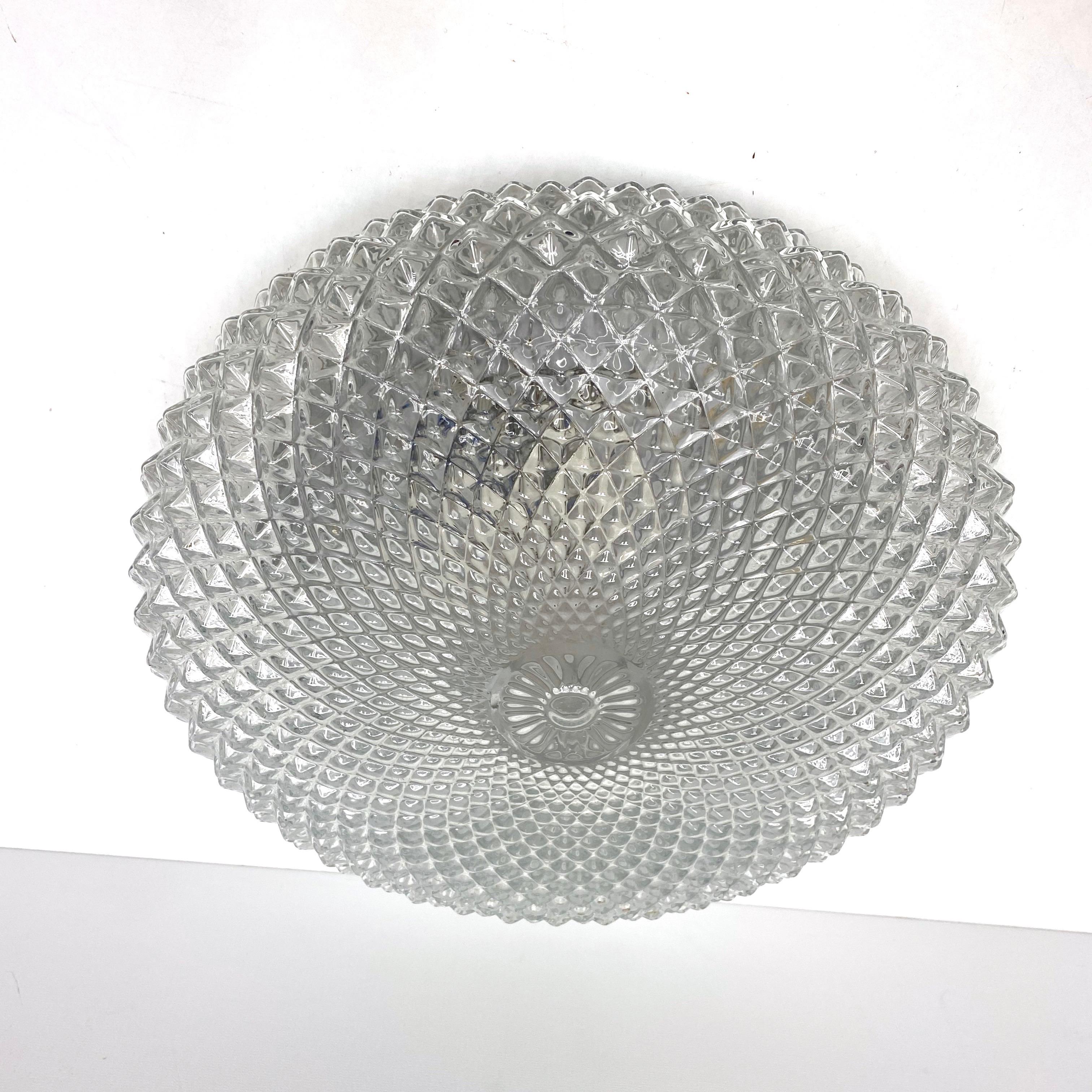 Stunning large crystal pattern clear glass flush mount. Made in Germany by Glashütte Limburg. Gorgeous textured glass flush mount with metal fixture. The fixture requires two European E27 Edison or medium bulb up to 60 watts.