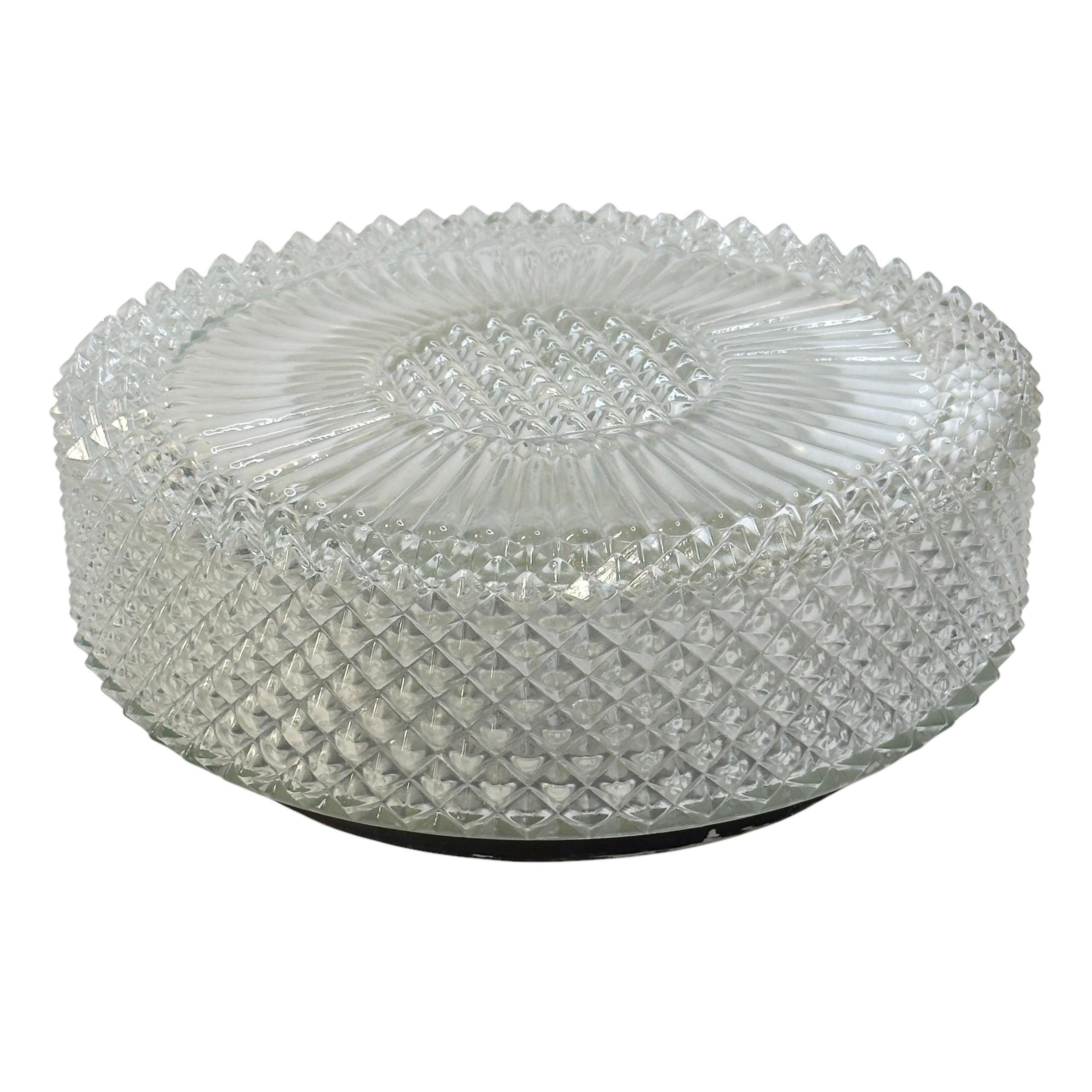 A beautiful flush mount ceiling light. Gorgeous textured glass flush mount with metal fixture. It has a very heavy glass with a crystal pattern design. The fixture requires two European E27 / 110 Volt Edison bulbs, up to 60 watts each bulb. A nice