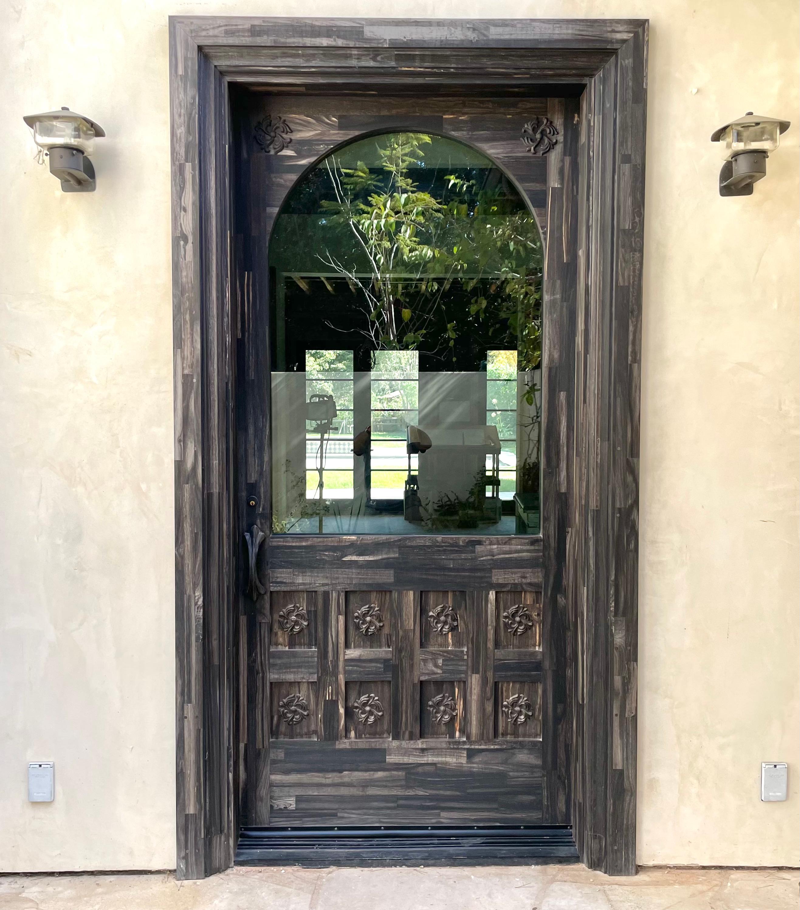 Monumental front door made by Chrome Hearts Los Angeles, for a Malibu home. Massive presence. One of one. Only door known to exist. Made custom by the owners of Chrome Hearts for the home owner. Solid silver door hinges with ornate crowns and Chrome