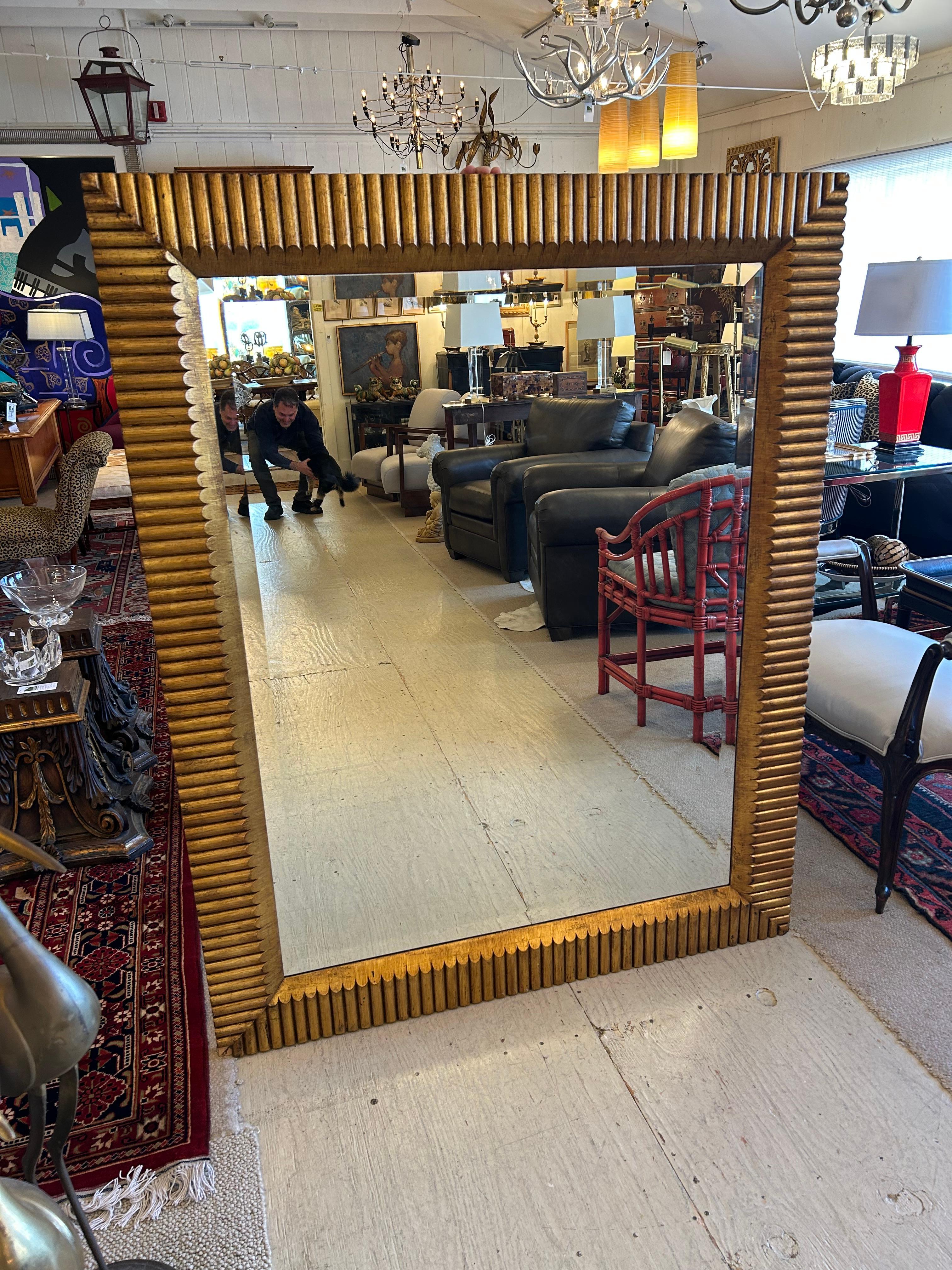Focal point huge impressive gilded wood mirror having sculptural carved wood chunky frame and bevelled mirror that measures 37 w x 49.5 h
