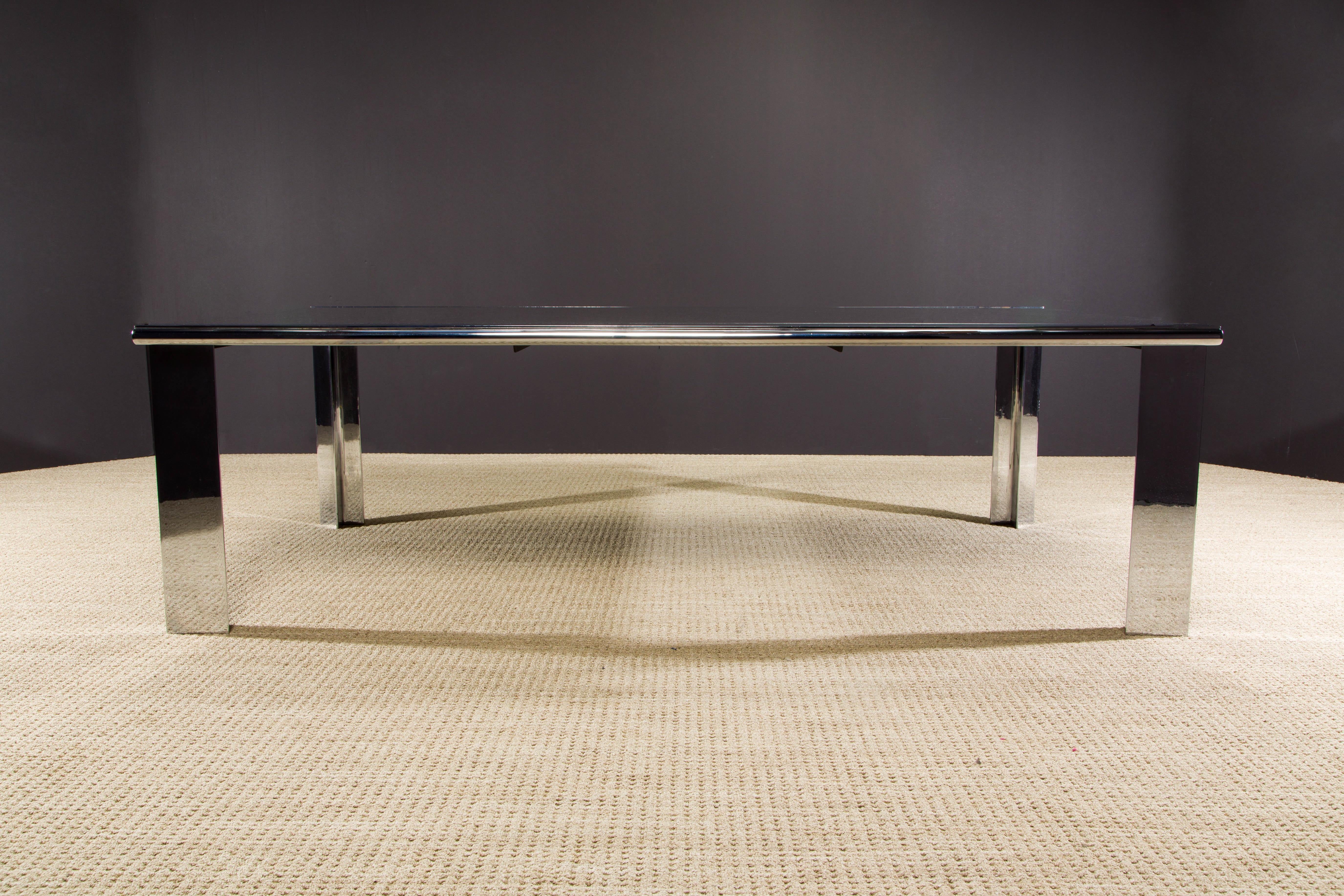 A jaw dropping monumental granite slab and steel dining table by famed Los Angeles architect Anthony Lumsden - custom designed and crafted for his Los Angeles home in the 1970s. Sleek, modern yet a subtle statement piece, partially due to its large