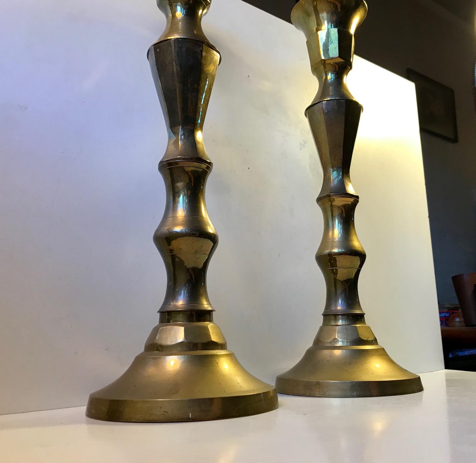 A pair of large church candlesticks in sculpted brass. These came out of a Church near Tjaeborg in the western part of Denmark. The design is very plain and almost has an Art Deco appearance to them. They have not been polished recently and the