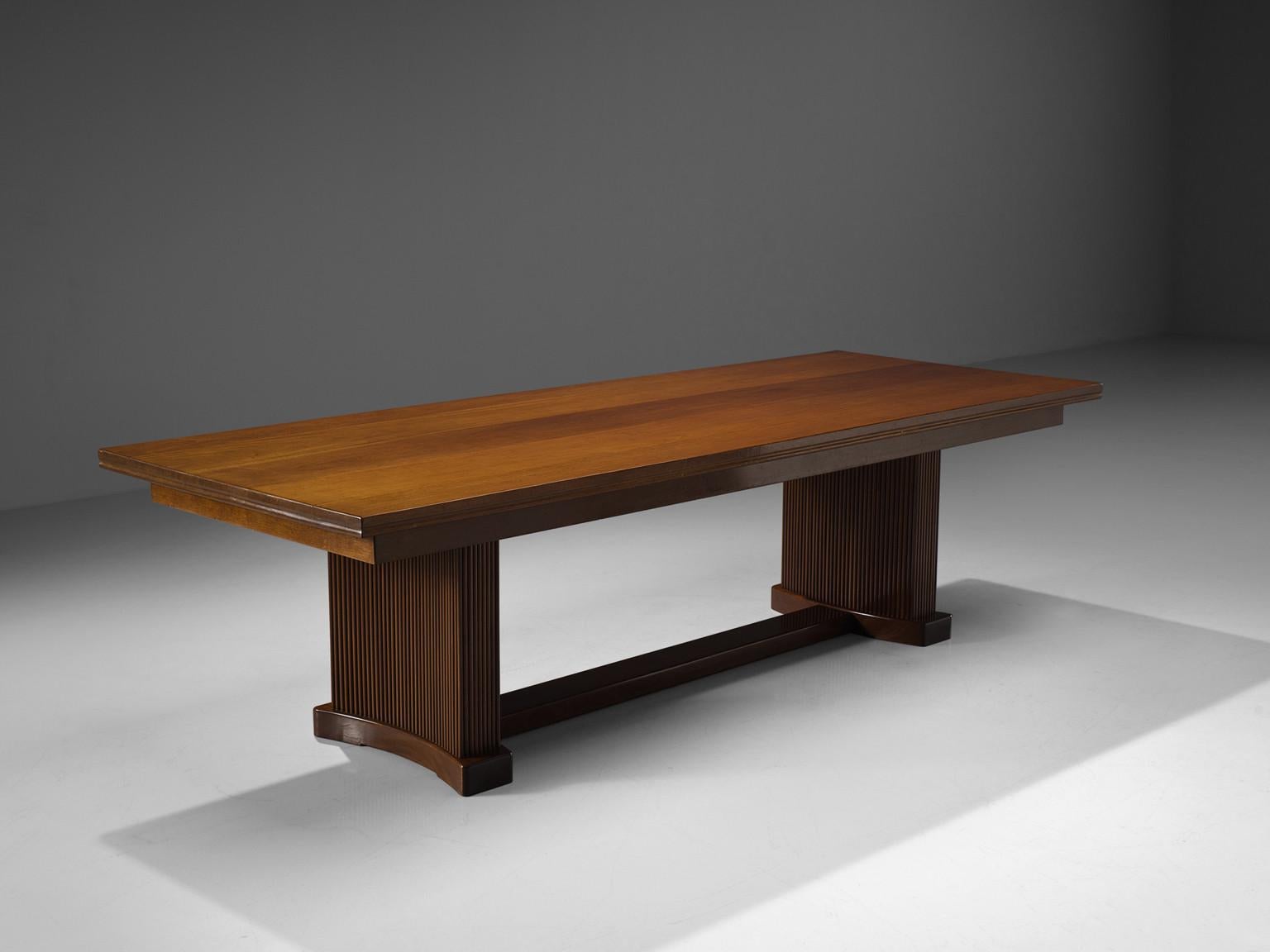 Conference table, mahogany, Denmark, 1940s

Gorgeous conference table in dark mahogany. The table has a monumental feel due to the beautifully crafted base that consists out of small mahogany ribs. This sculptural feeling is emphasized by the warm