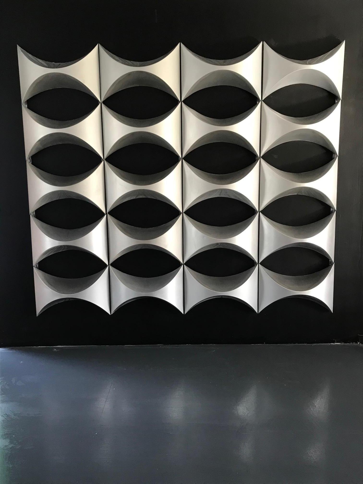 Monumental decorative wall panel, element of French architecture 1970.
This panel is made up of 20 polished aluminum modules. They come from a building facade. 

The Study Center Egg was created in 1962, passage Du Guesclin in Paris. It is a