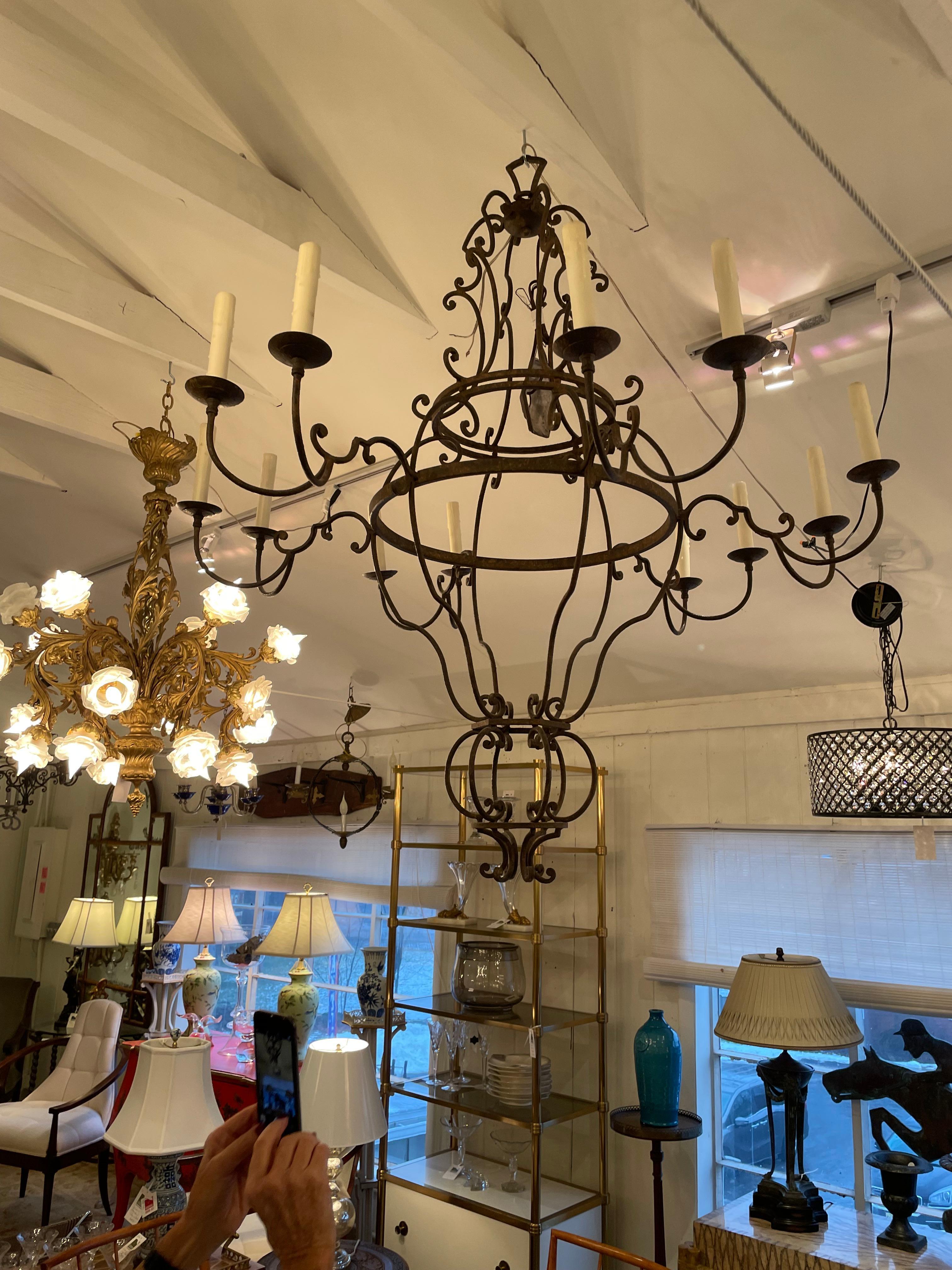 A gorgeous Holly Hunt designed very large dark brown wrought iron chandelier having a beautiful airy shape, lots of curlicues and an impressive span of 12 arms.
Comes with extra handsome chain.