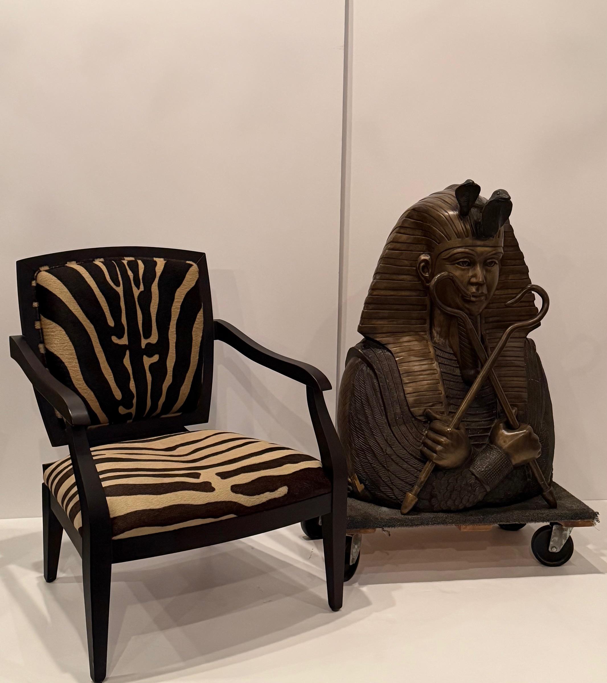 Dramatic in scale, huge cast bronze sculpture of King Tut holding two scepters that are removeable.  Great detail and patina.