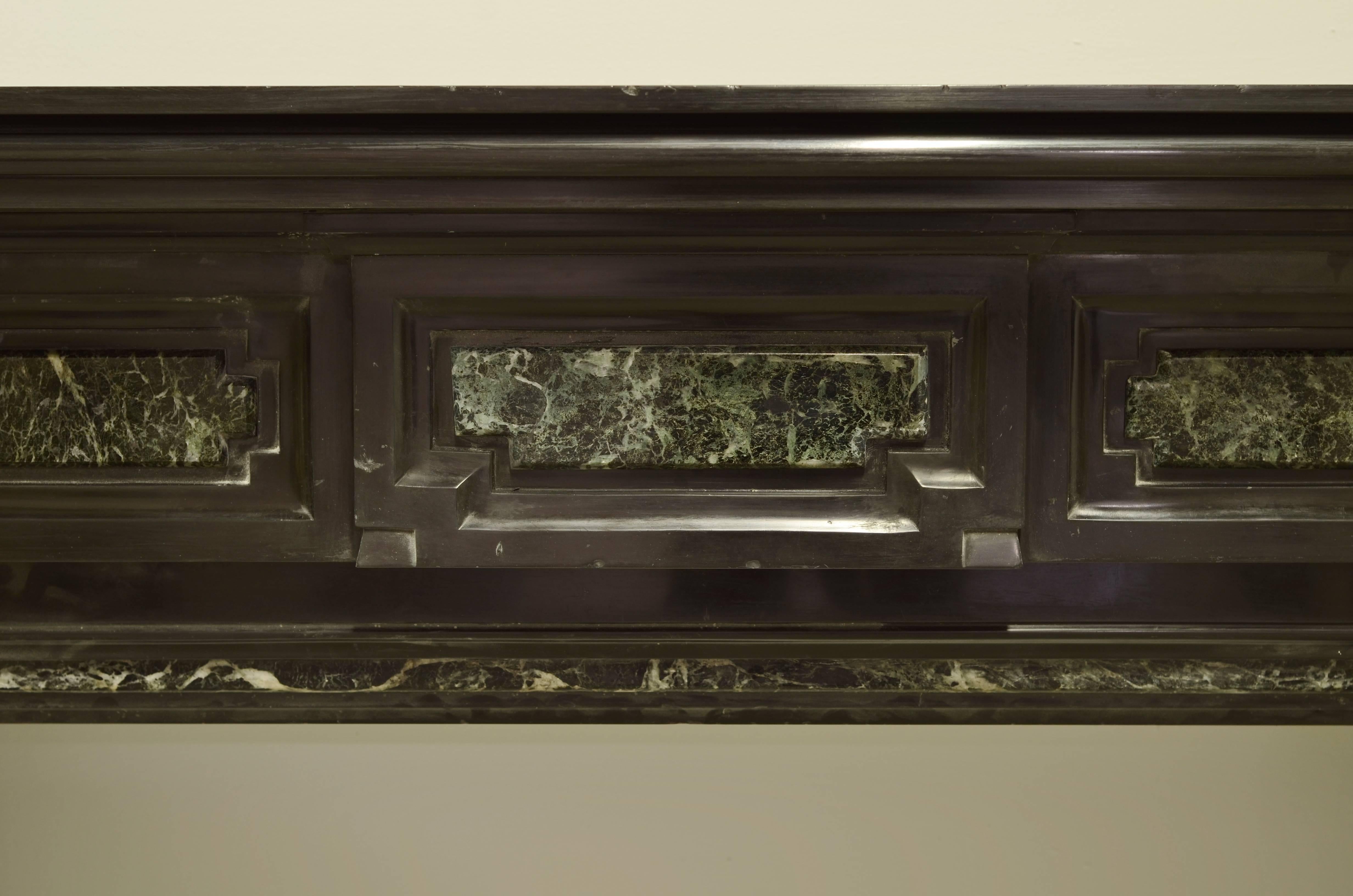 Monumental Dutch mantelpiece from the 19th century.

Beautiful deep black Belgian marble with green (