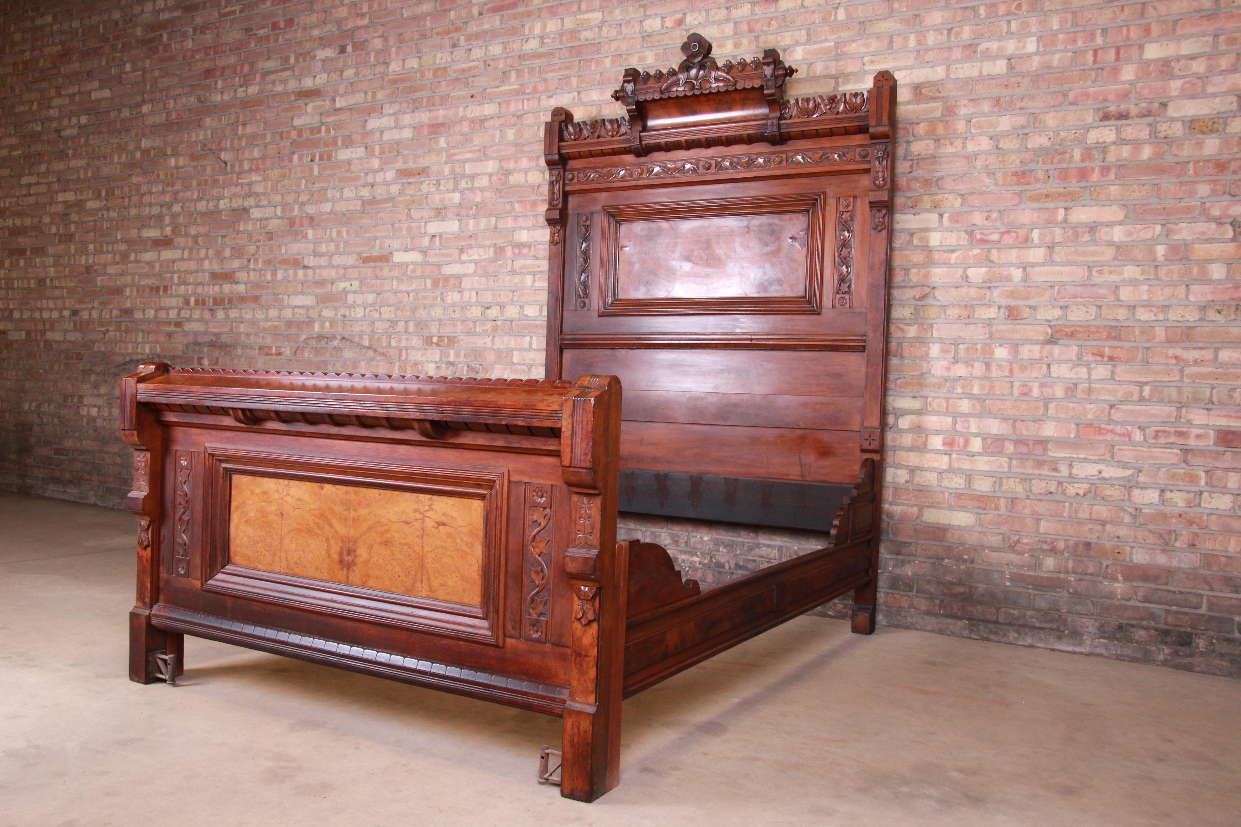 A rare and outstanding Victorian Eastlake full size bed frame

Originally purchased from Marshall Field's in Chicago, circa 1870

Ornate carved walnut and burl wood with floral motif.

Measures: 57.75