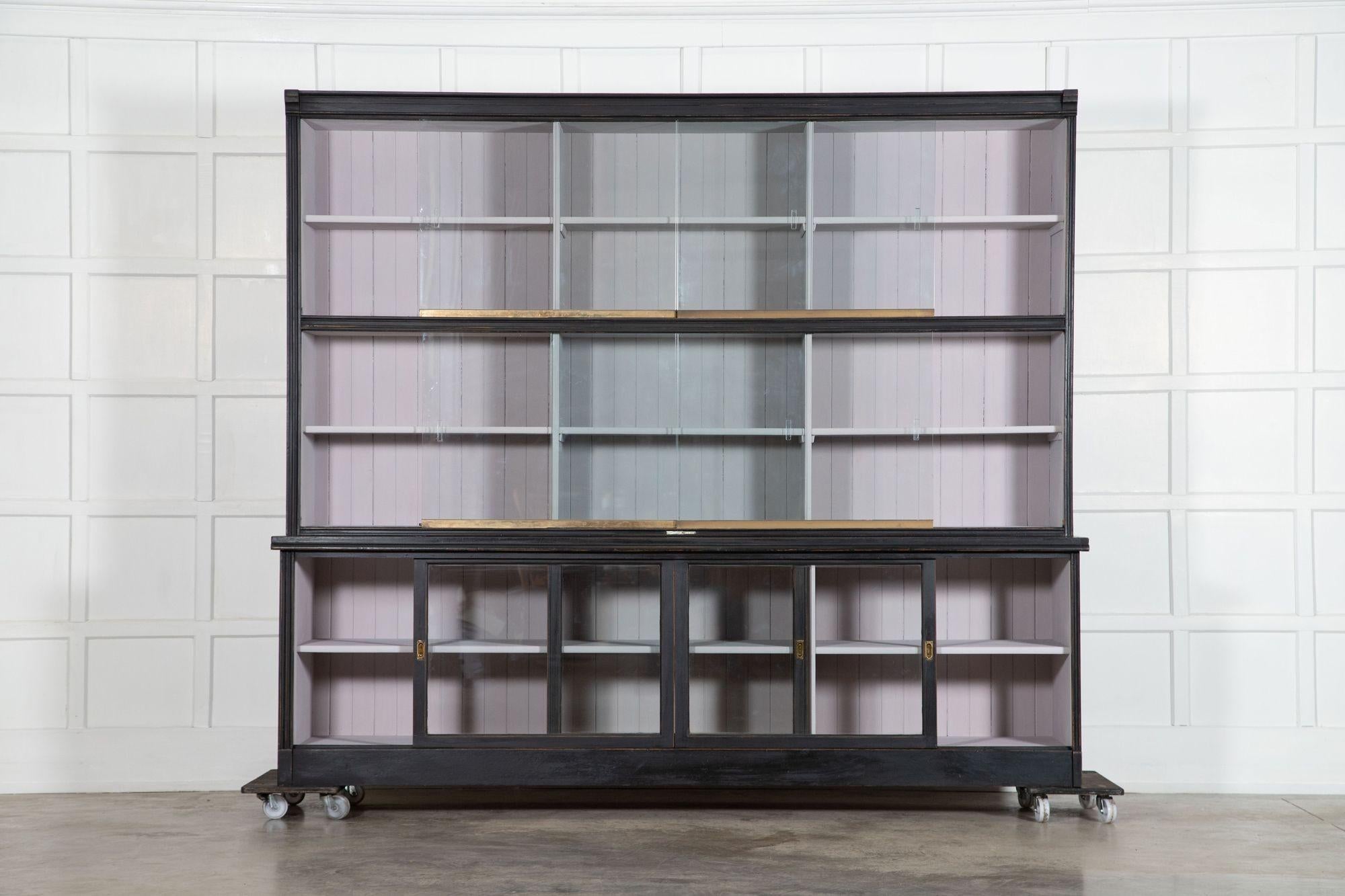 circa 1900
Monumental Ebonised Glazed Mahogany & Pine Haberdashery Cabinet with 9 glazed sliding doors
An exceptional example
sku 1404
Together W249 x D57 x H213.5 cm
Base W249 x D57 x H76 cm
Base internal shelf depth 43.5 cm
Top W244 x D42 x H137.5
