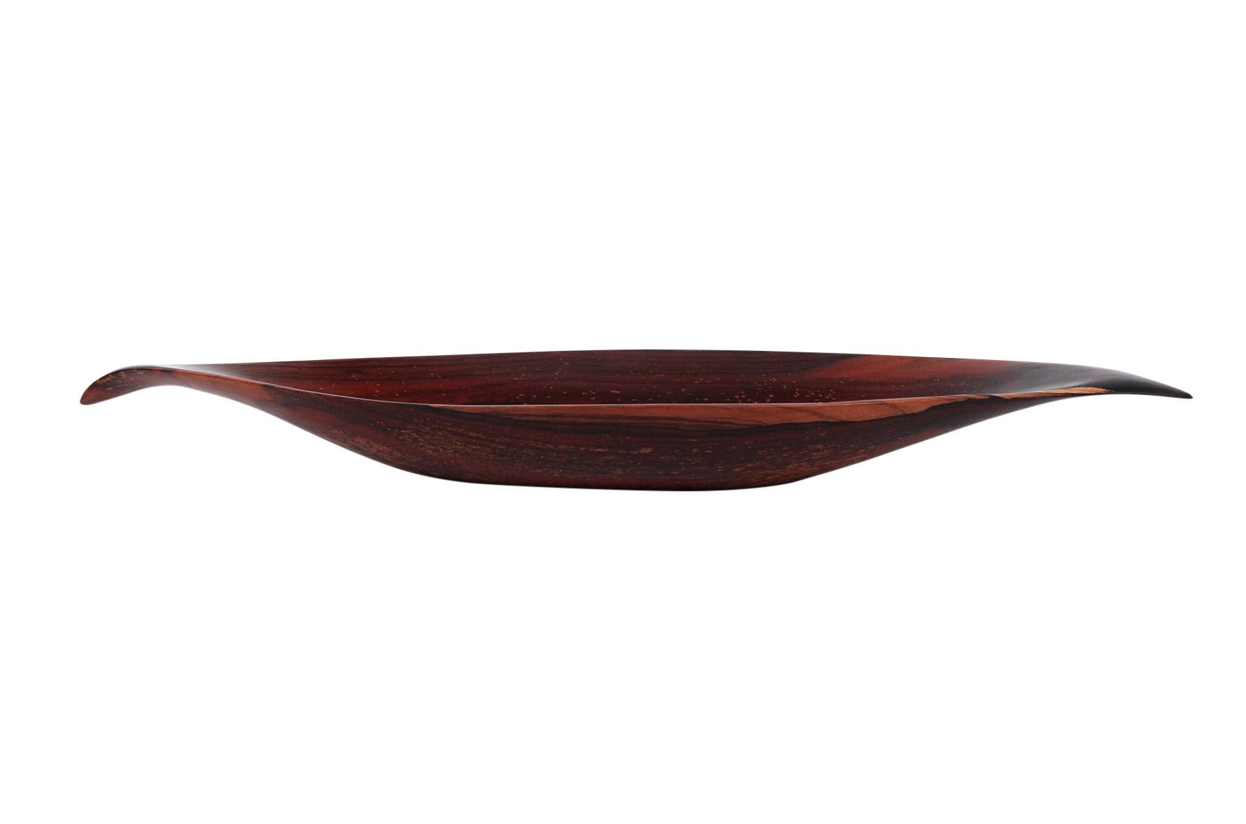 Impressive sculptural bowl in rosewood by Emil Milan known as “Emilan”. This is one the largest bowl forms to have come to market at 3ft long. Milan was an American woodworker known for his bowls and carved sculptures. He trained at the Arts Student