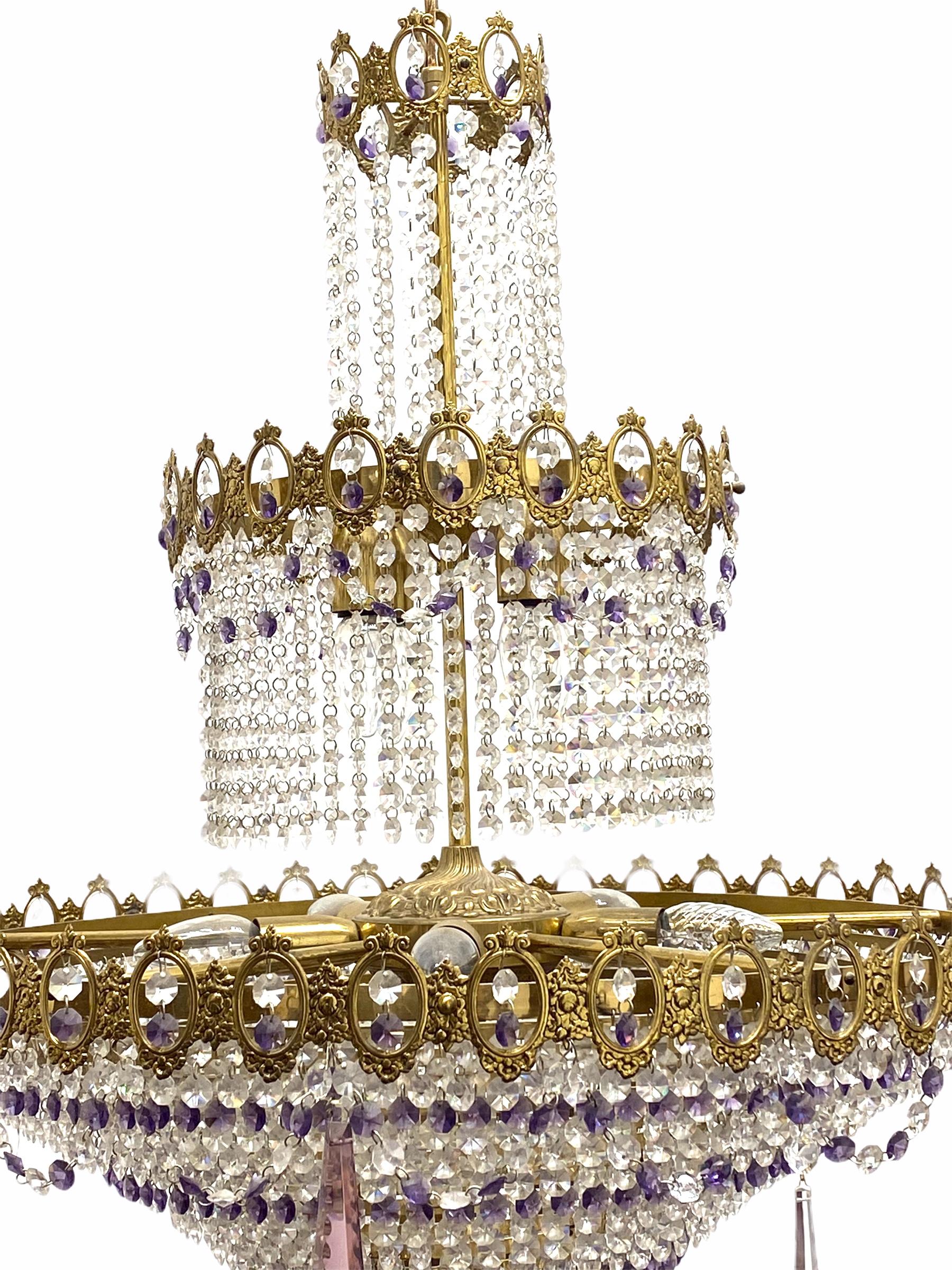 Austrian crystal chandelier with a solid bronze frame and faceted crystal, circa 1930s or older. This chandelier is perfect for large spaces, entryways, and hallways. A unique waterfall chandelier with a Hollywood Regency or Empire flair, the